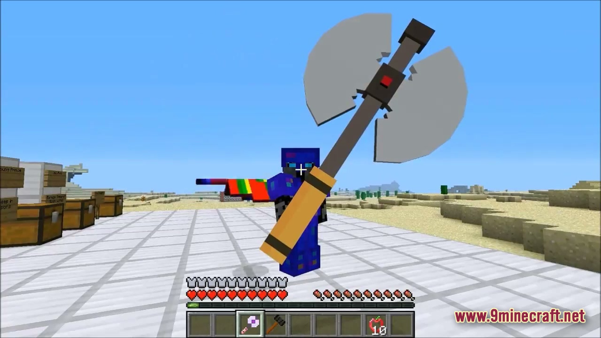 Ore Spawn Adventuree Modpack Screenshot 1 A player character in blue armor holds a large double-headed battle axe in a desert biome