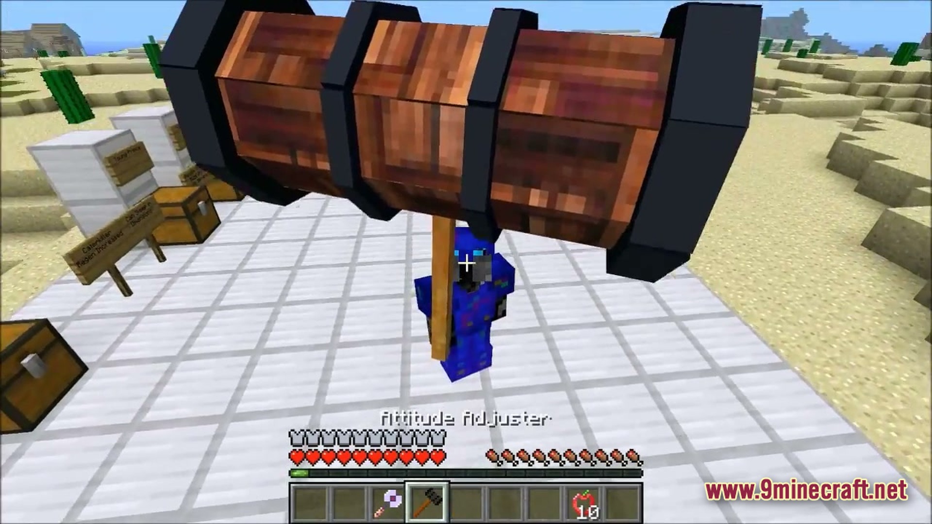 Ore Spawn Adventuree Modpack Screenshot 2 A player in blue armor holds the Attitude Adjuster hammer weapon in a desert biome