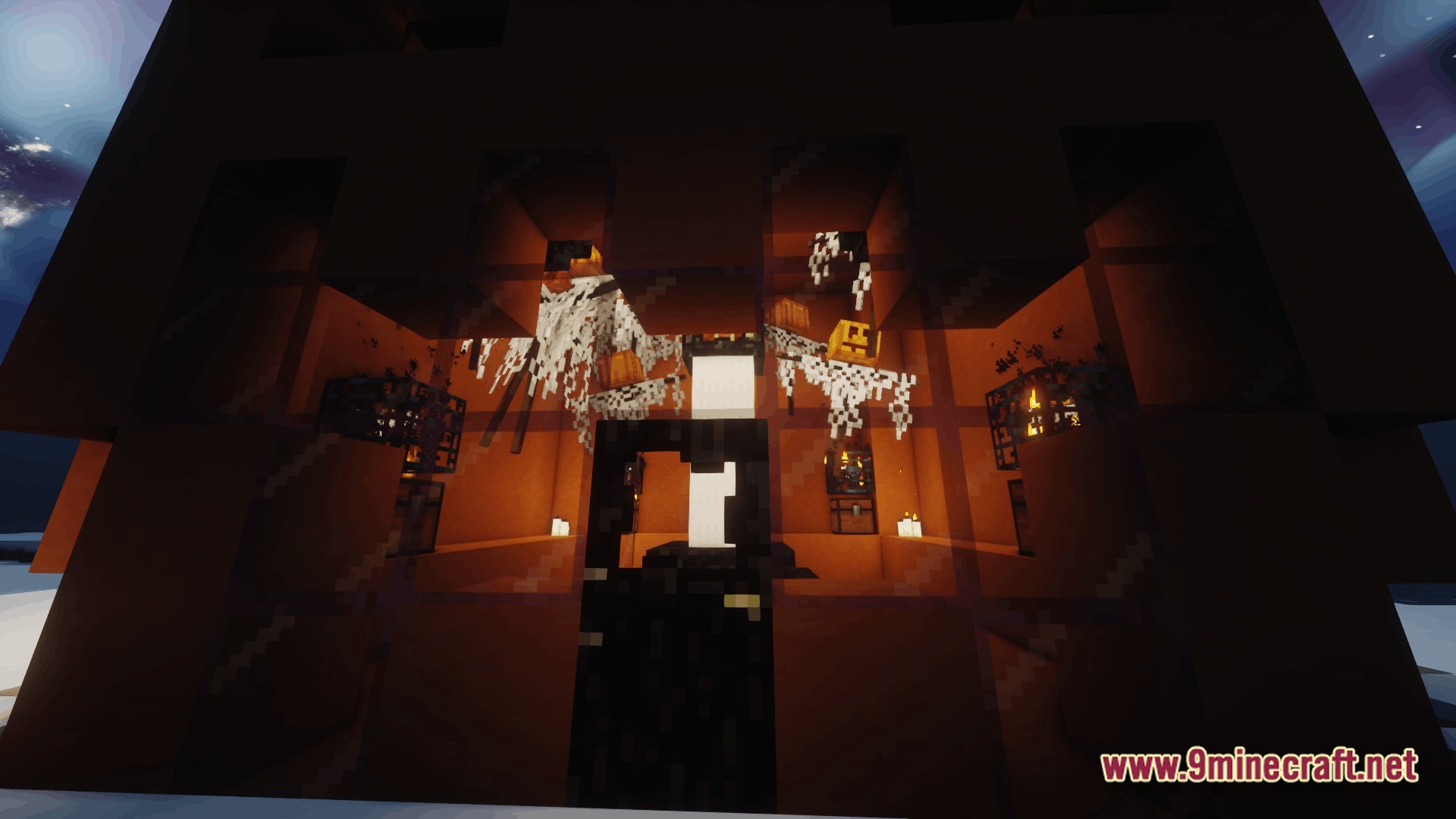 Ore Spawn Adventuree Modpack Screenshot 9 A dimly lit interior structure featuring cobwebs, pumpkins, and monster spawners behind glass panes