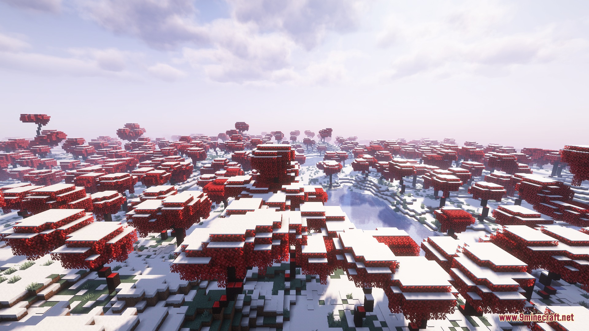 Red leaf trees covered in snow spread across a frozen winter biome landscape