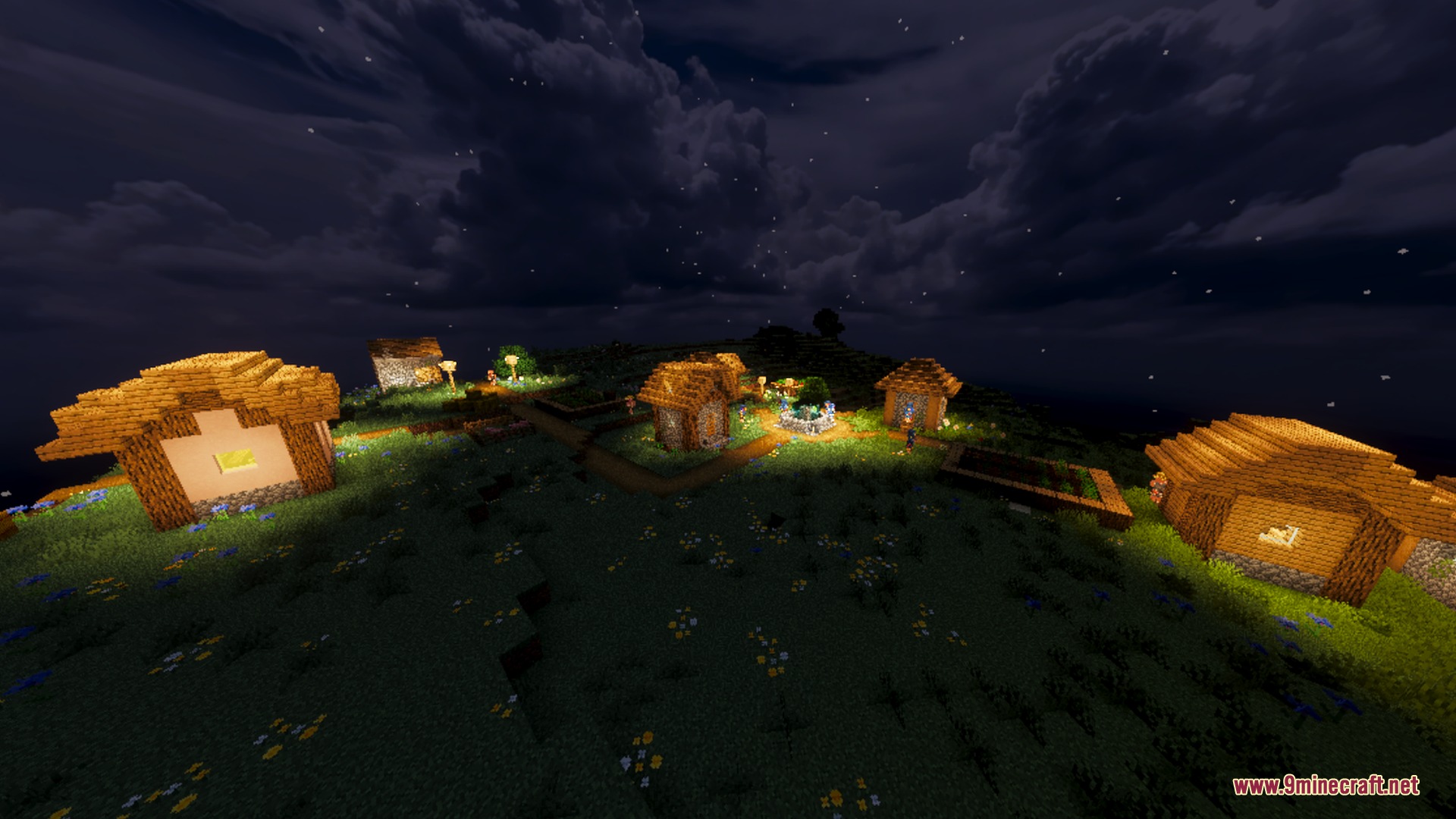 Warm lights illuminate a small Minecraft village under a cloudy night sky