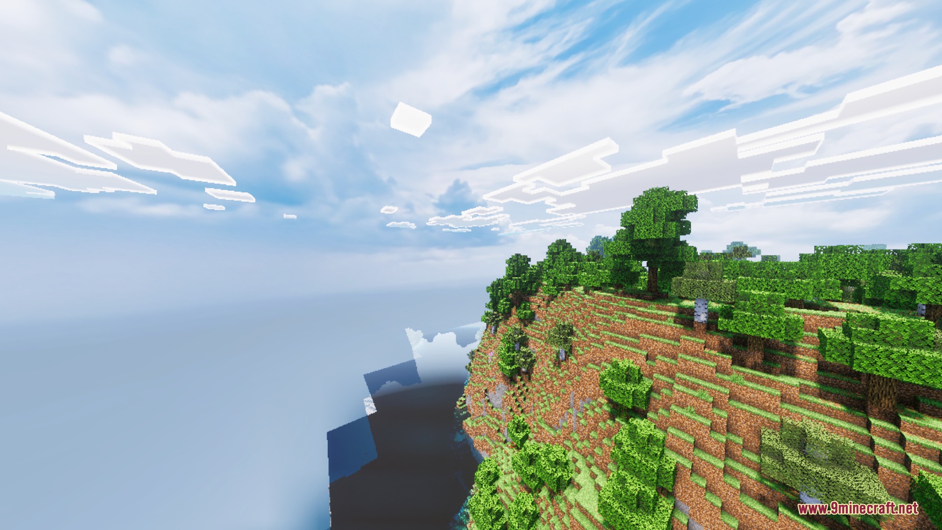 Scenic view of a lush green cliffside overlooking the ocean in Minecraft
