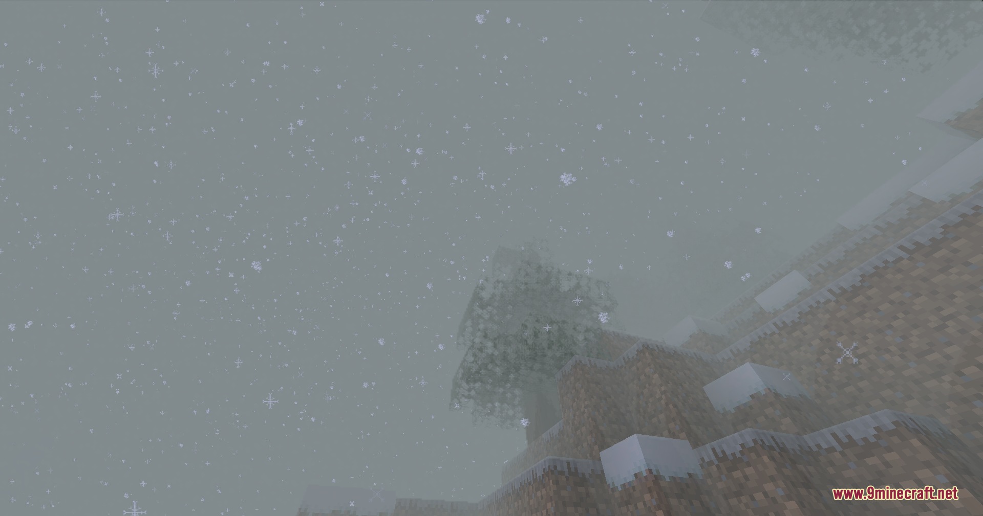 PMW Precipitation Redone Resource Pack Screenshot 3 Detailed snow particles falling over a snowy hill with a single tree