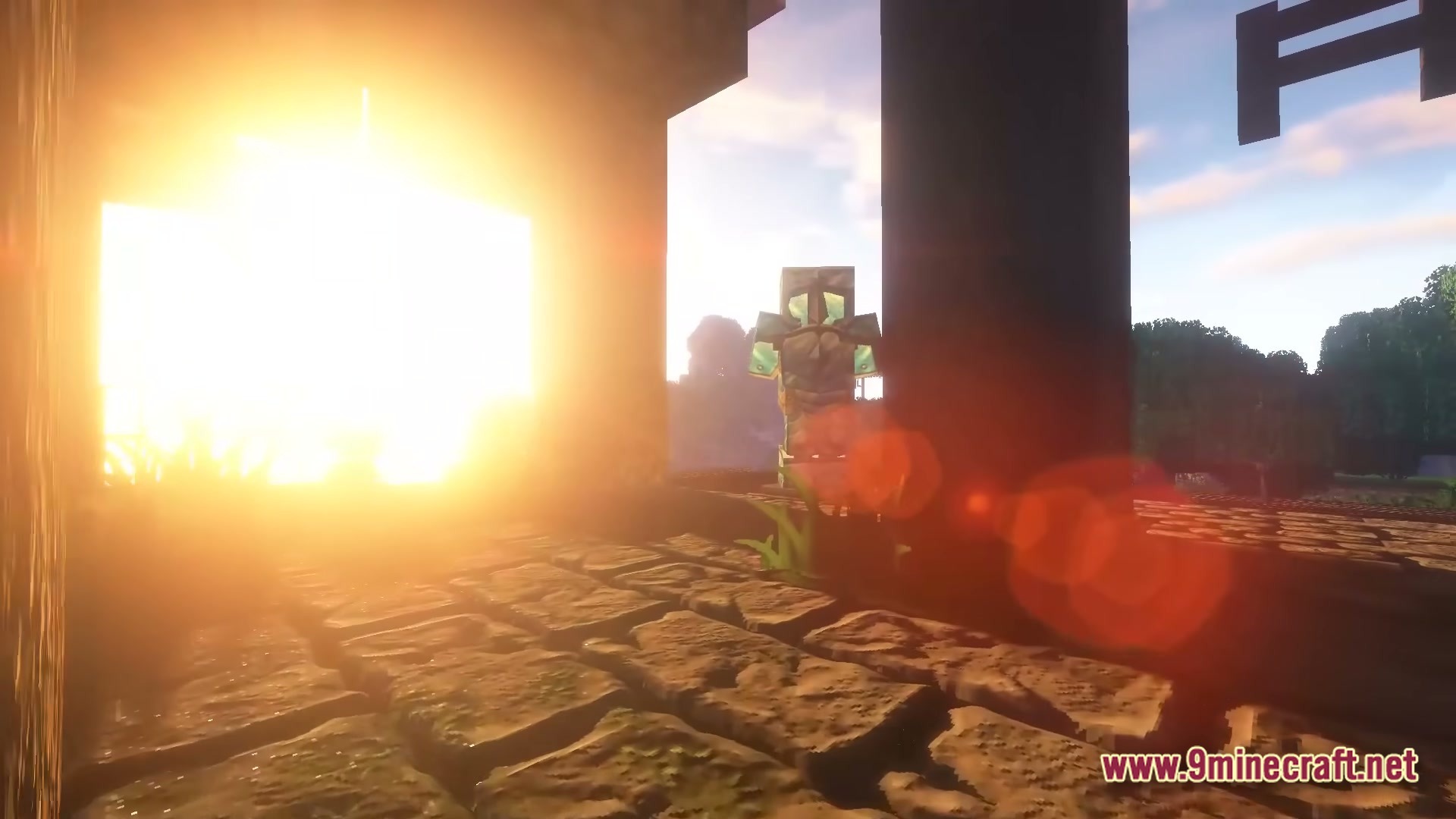 An armored player character stands near a stone structure under bright sunlight with lens flare
