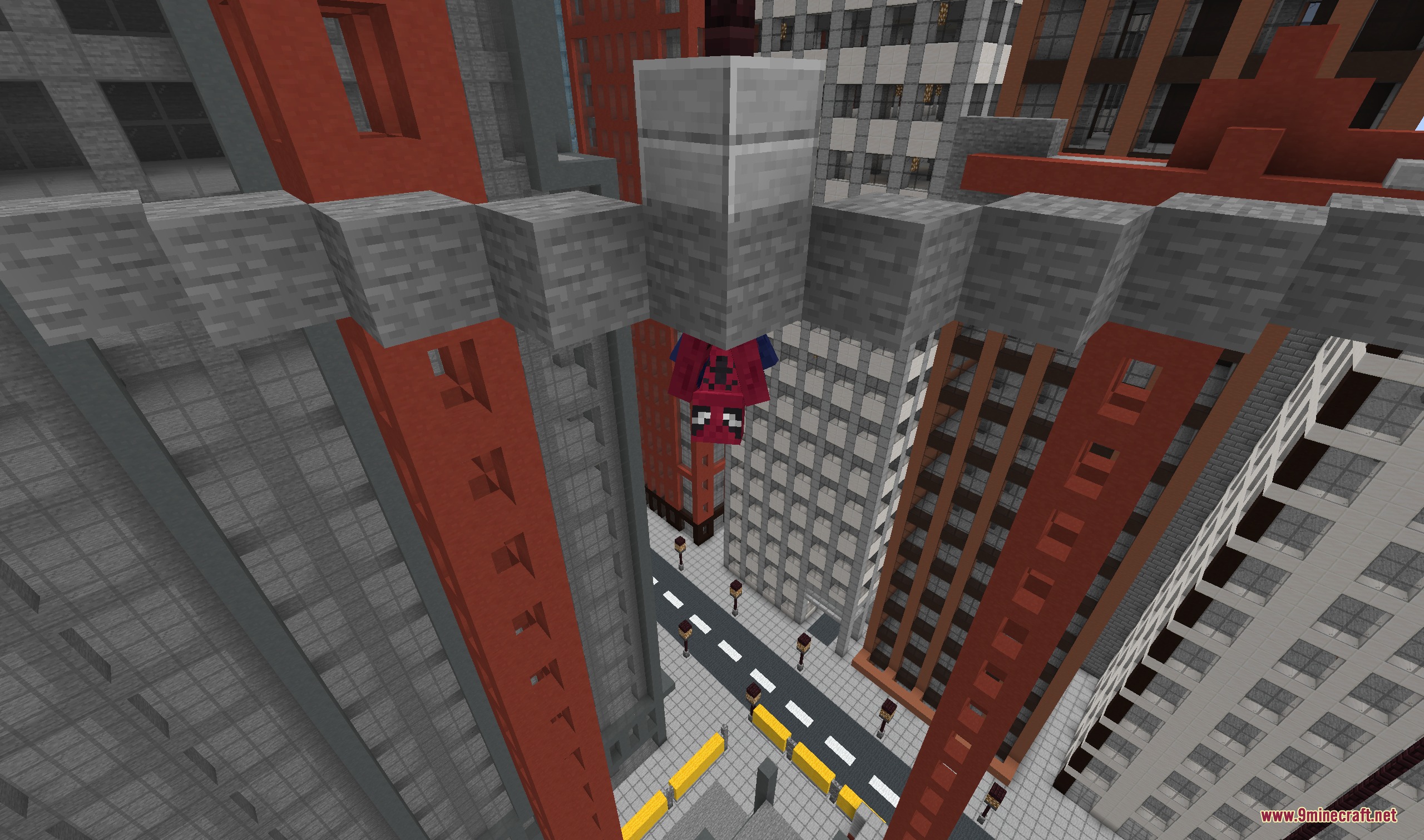 Spiderman hanging upside down from a stone bridge between city skyscrapers