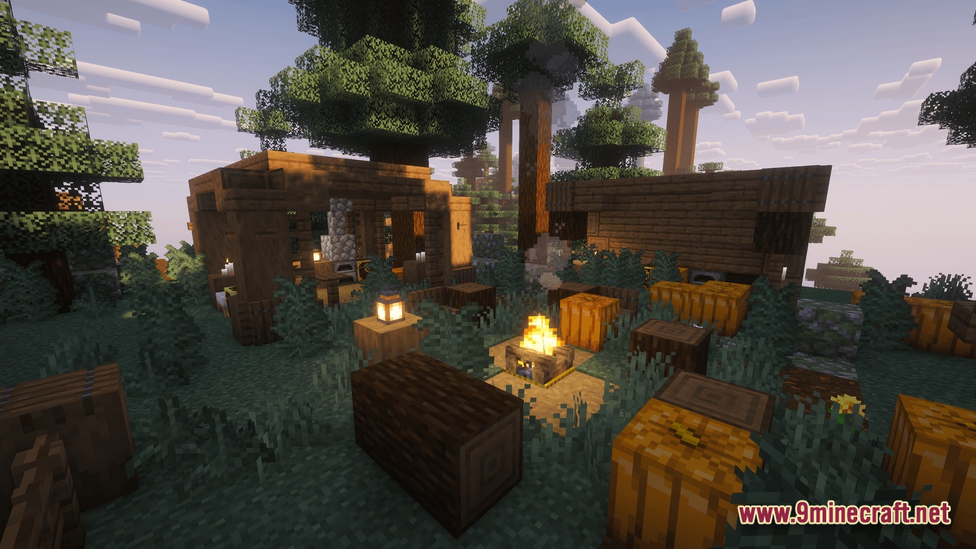 Perennial Core Modpack Screenshot 1 A rustic campsite with a campfire, wooden structures, and pumpkins set within a dense forest biome
