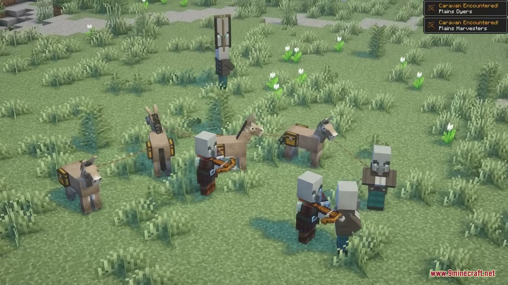 Pillager Caravans Mod Screenshot 6 Pillagers with loaded donkeys and crossbows traveling across a grassy field