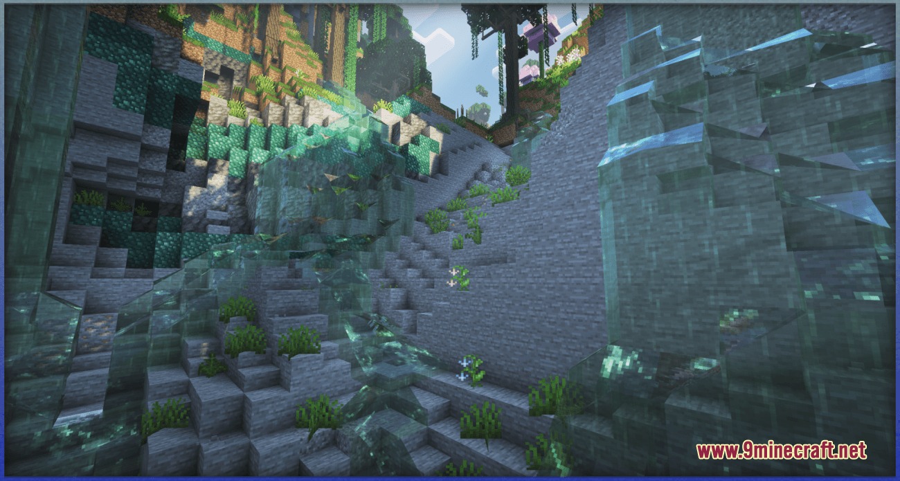 Lush greenery and flowers growing on stone cliffs near a waterfall