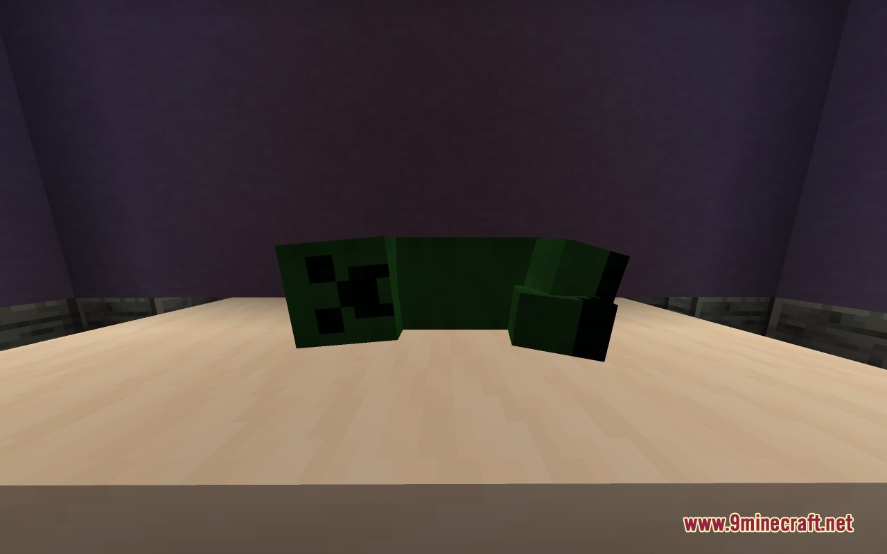 Plush Age Resource Pack Screenshot 6 A green Creeper plushie lying flat on a wooden surface in Minecraft