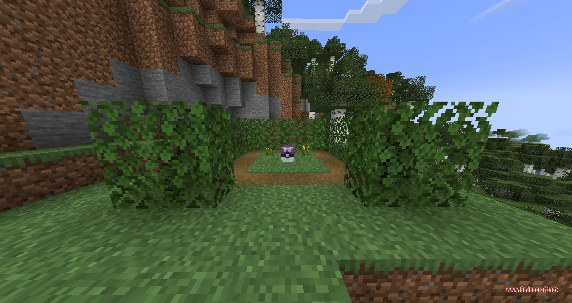 A purple Poke Ball loot capsule sits on a grass patch in Minecraft