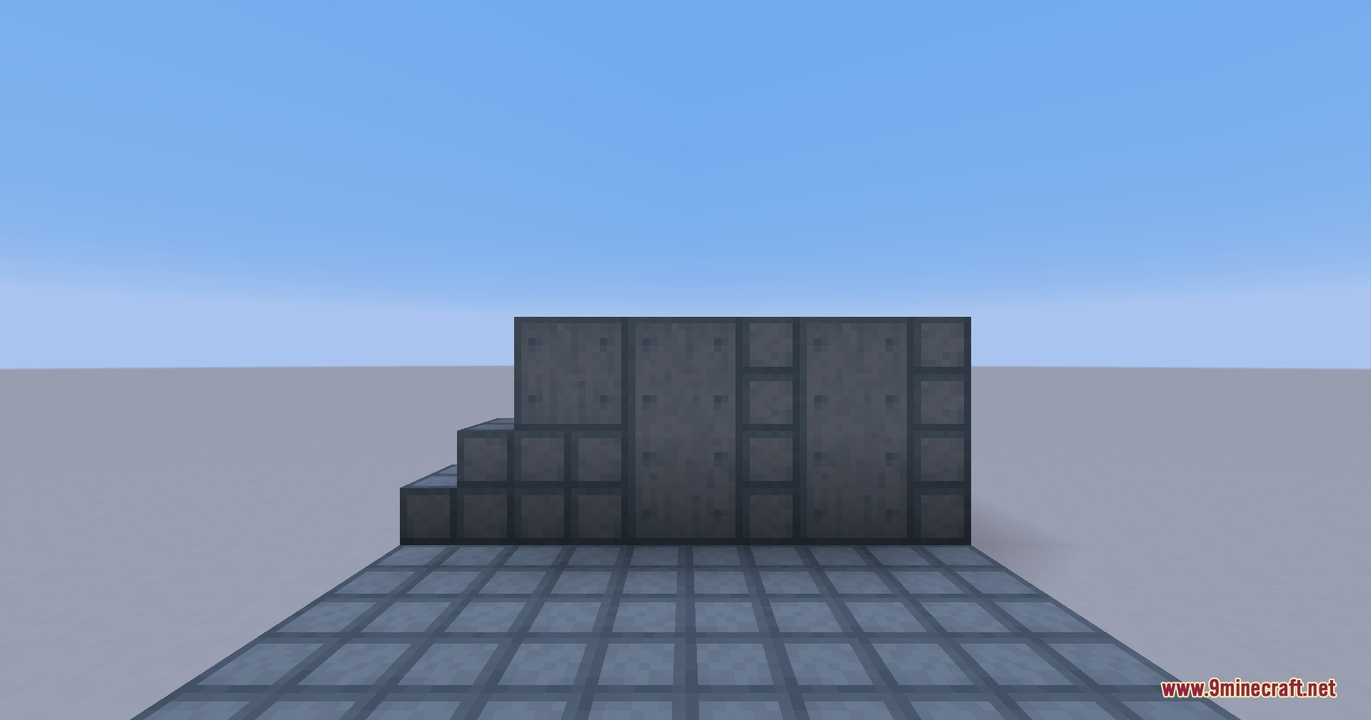 Various grey industrial blocks and panels forming a wall in a test room