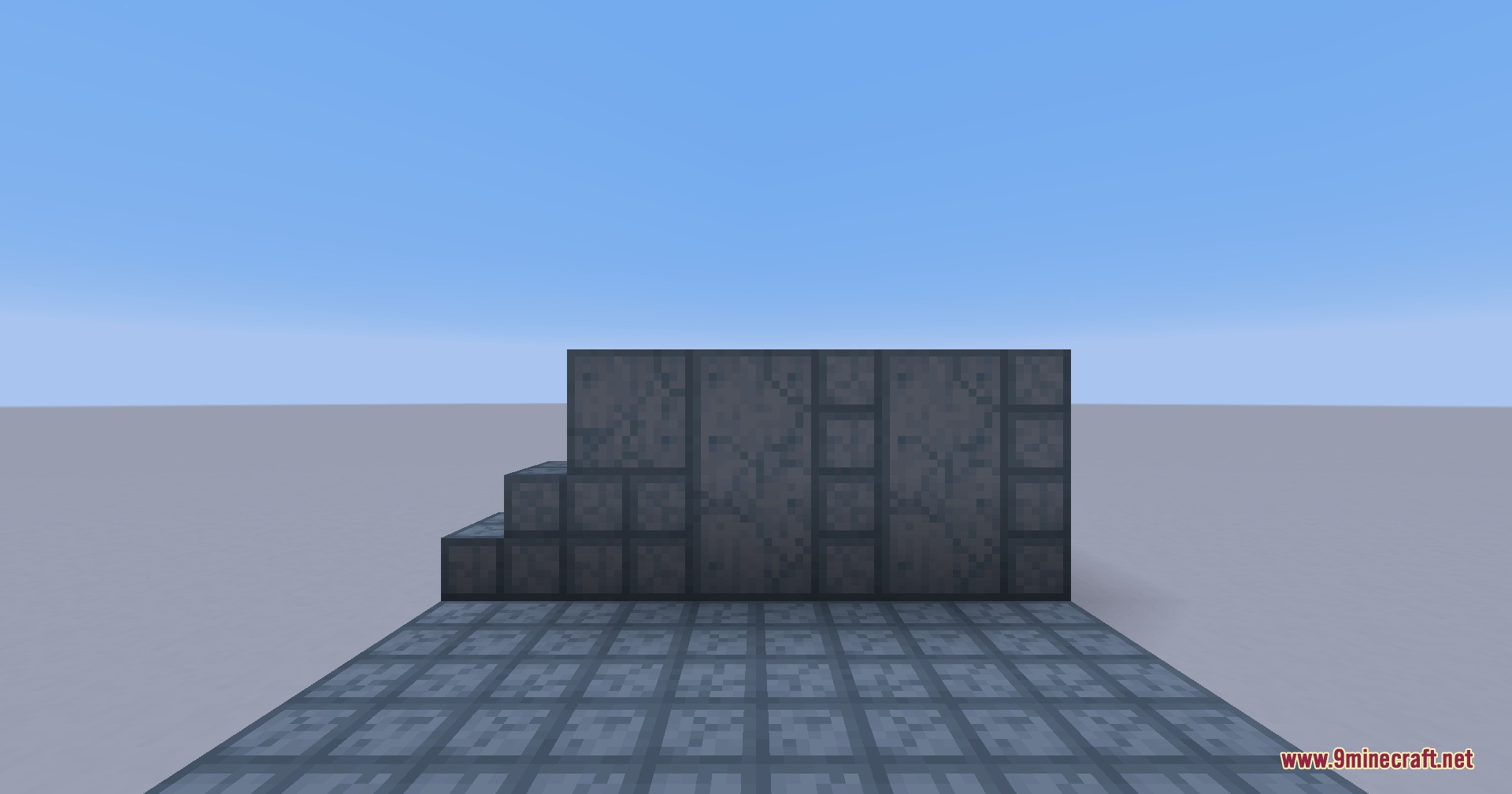 Various dark industrial blocks from the Portal Mod displayed in Minecraft