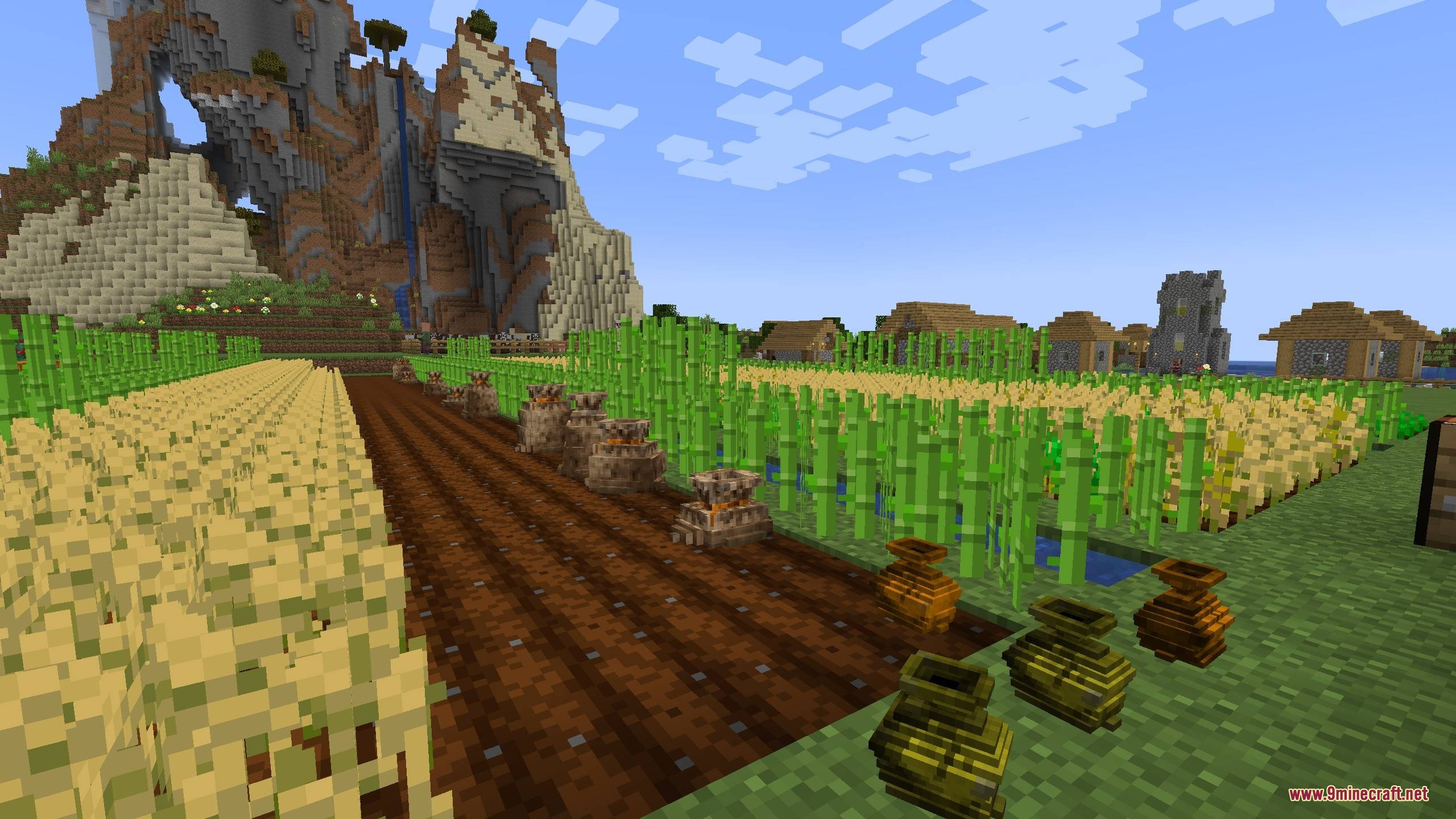 Pouch & Paper Mod Screenshot 1 Storage pouches and sacks placed on the ground near a farm in Minecraft