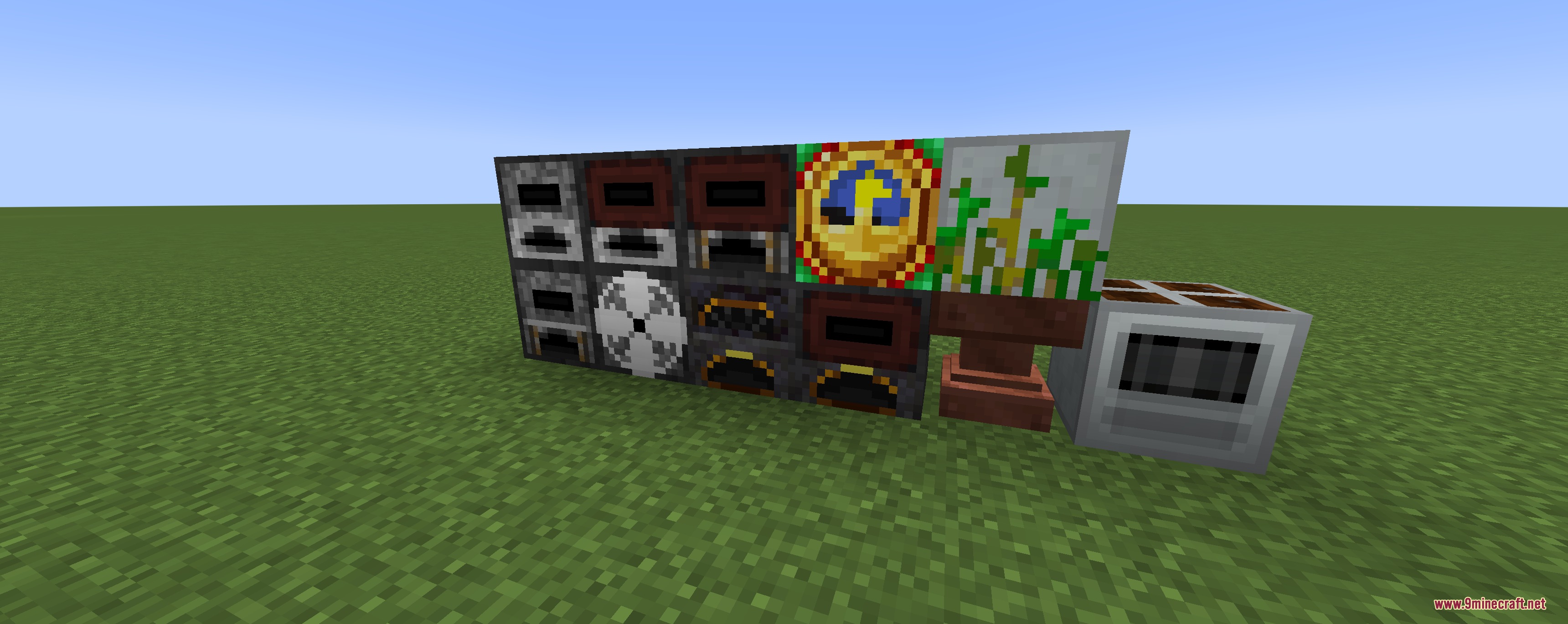 Automation machinery blocks from the Primitive Circuits Mod on a grassy field