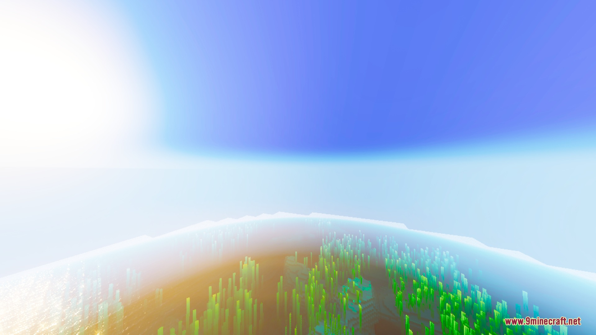 Bright sunlight and thick atmospheric fog over a vibrant landscape