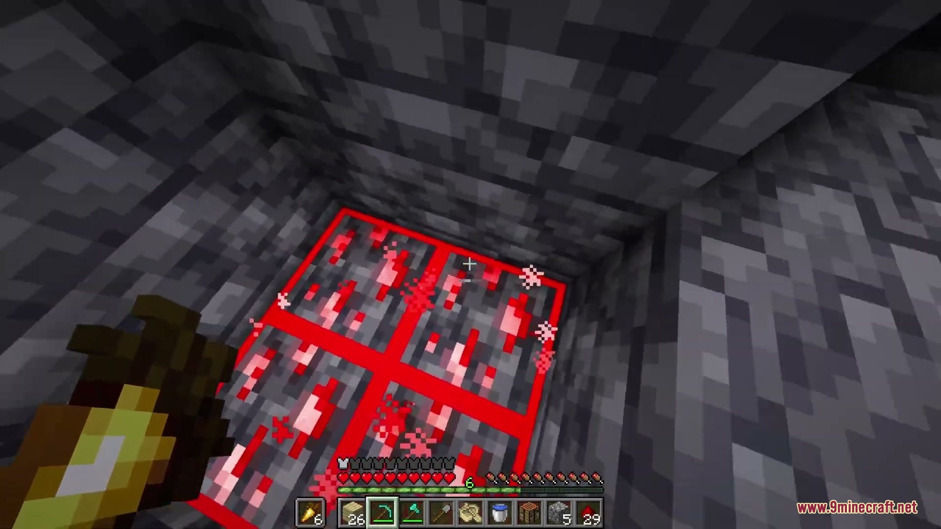 Pristine Vein Deposits Resource Pack Screenshot 4 A player looks down at redstone ore blocks with distinct red borders