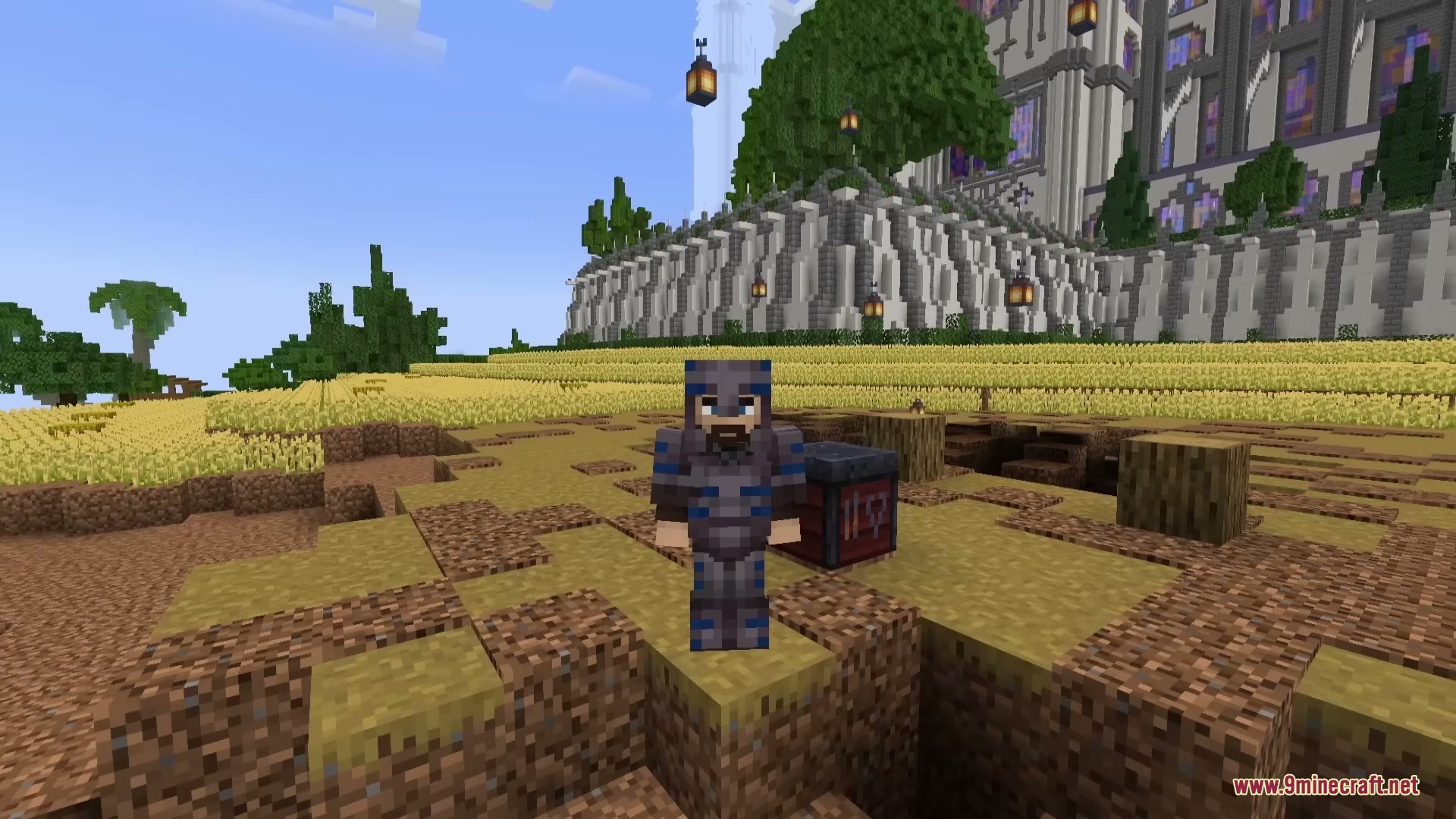 Pulse Trims Mod Screenshot 2 Minecraft character wearing armor with blue trims standing in a wheat field