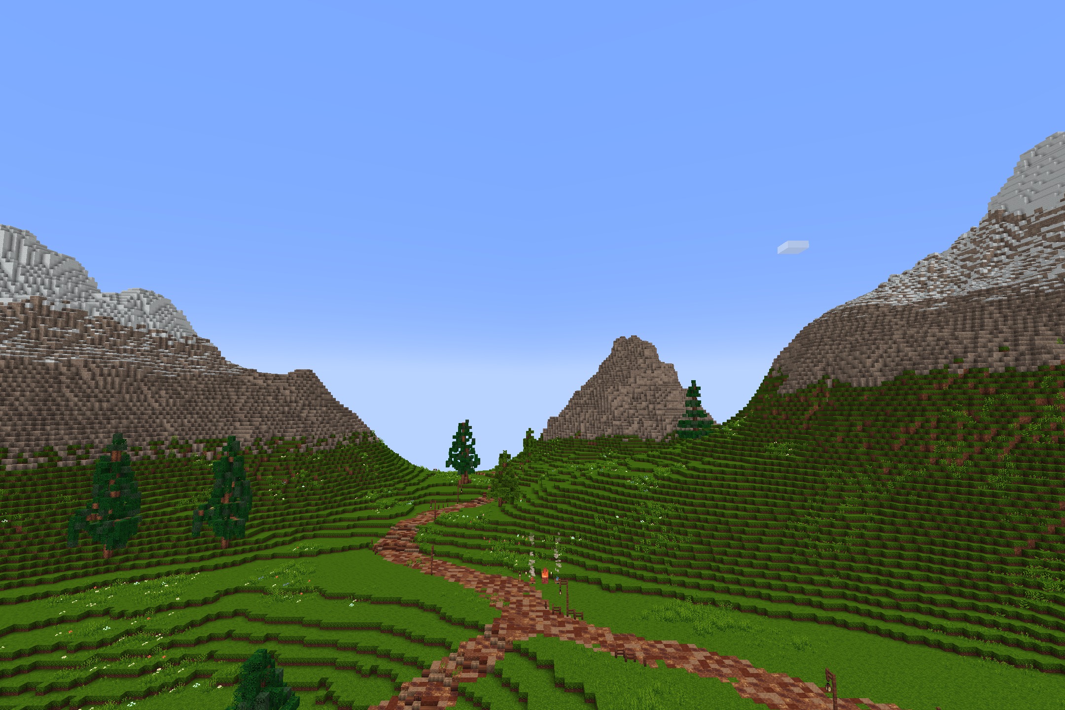 Quadral Pack Resource Pack Screenshot 10 Lush green hills with a dirt path leading towards distant snowy mountains