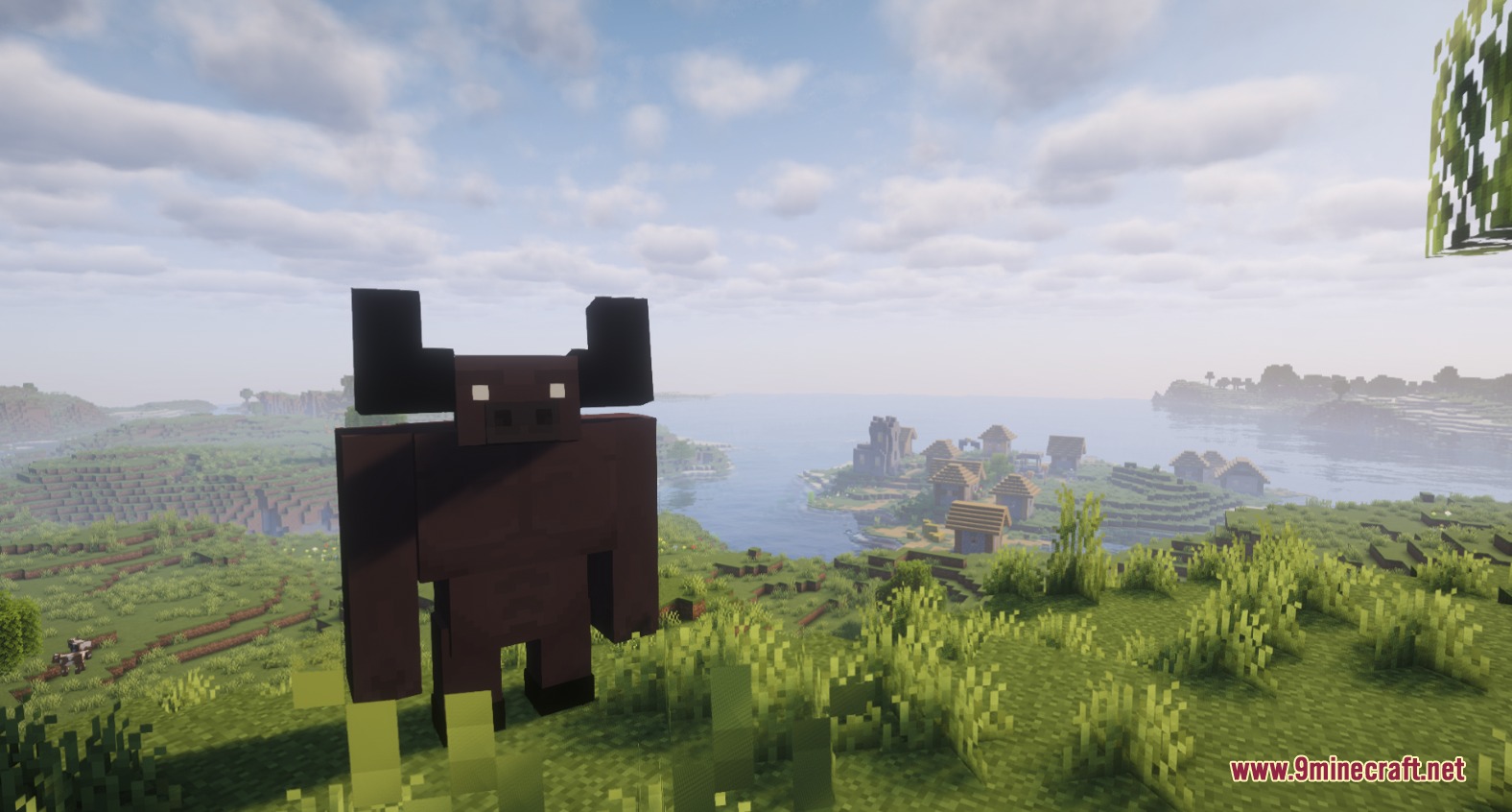 RPG Adventurer Mod Screenshot 8 A large brown Minotaur miniboss standing on a hill overlooking a coastal village