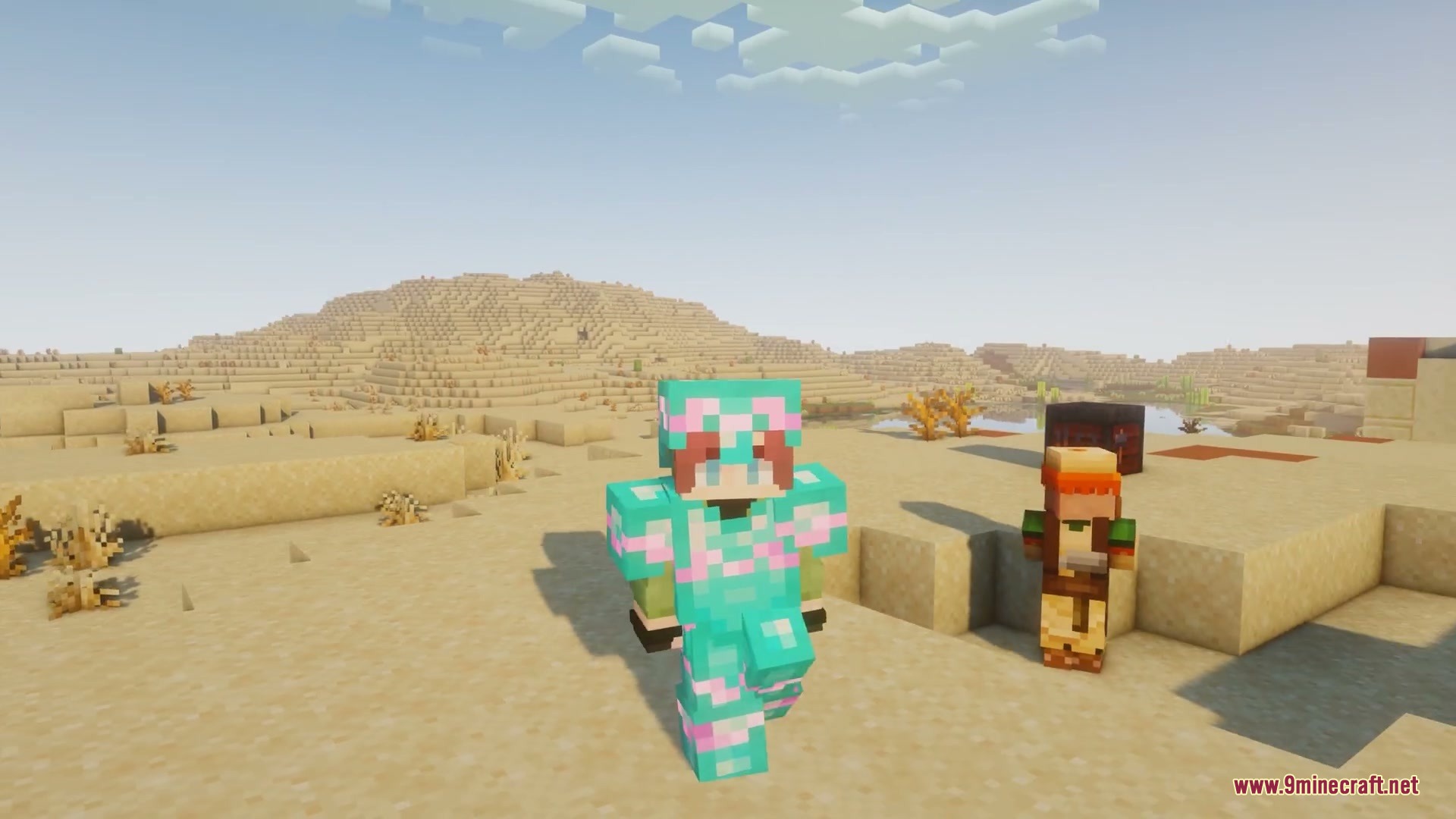 A player wearing cyan armor with glowing pink trims walks through a desert