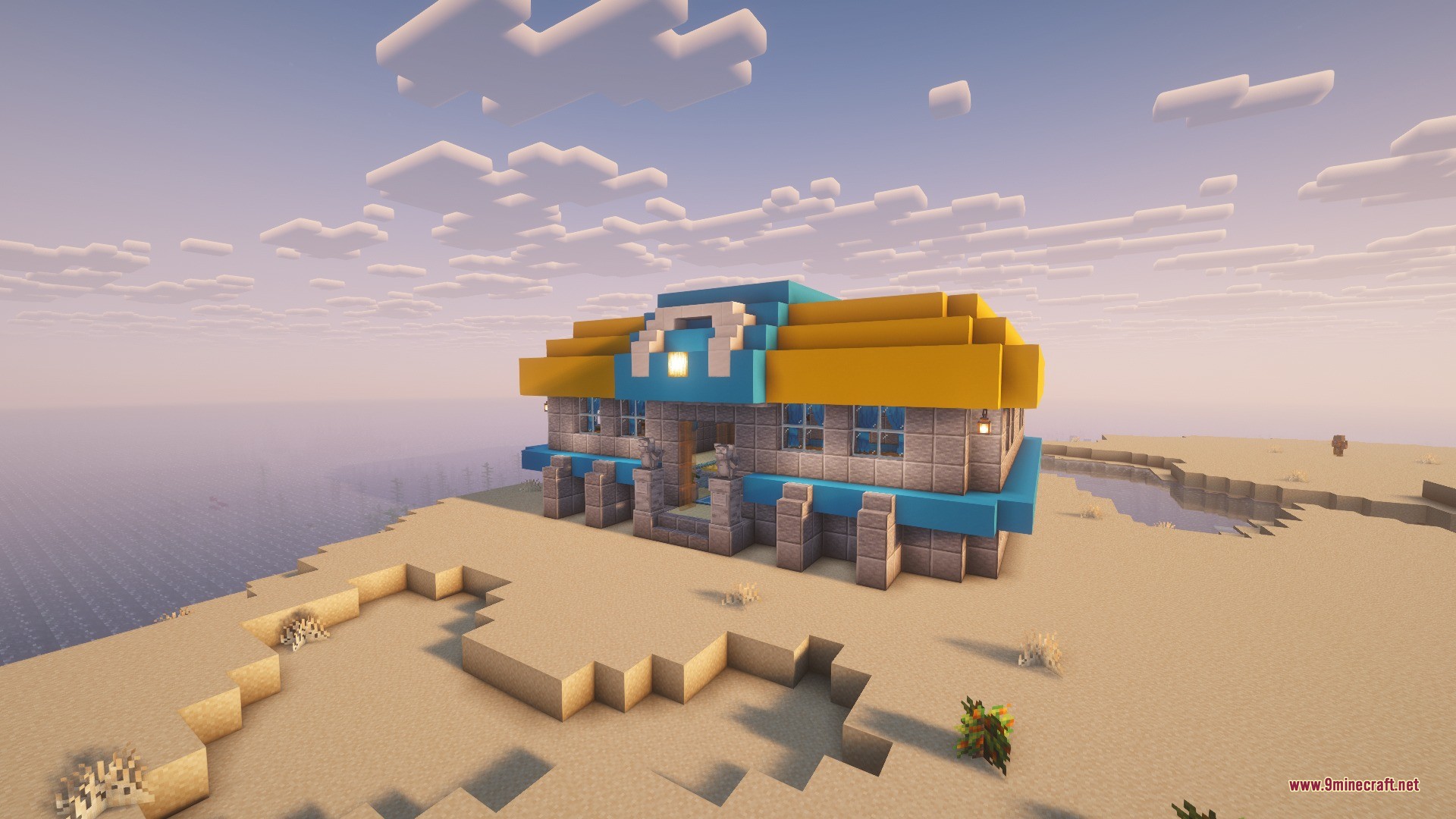 Radical Gyms & Structures Data Pack Screenshot 1 A stone gym building with a colorful roof stands on a sandy coast