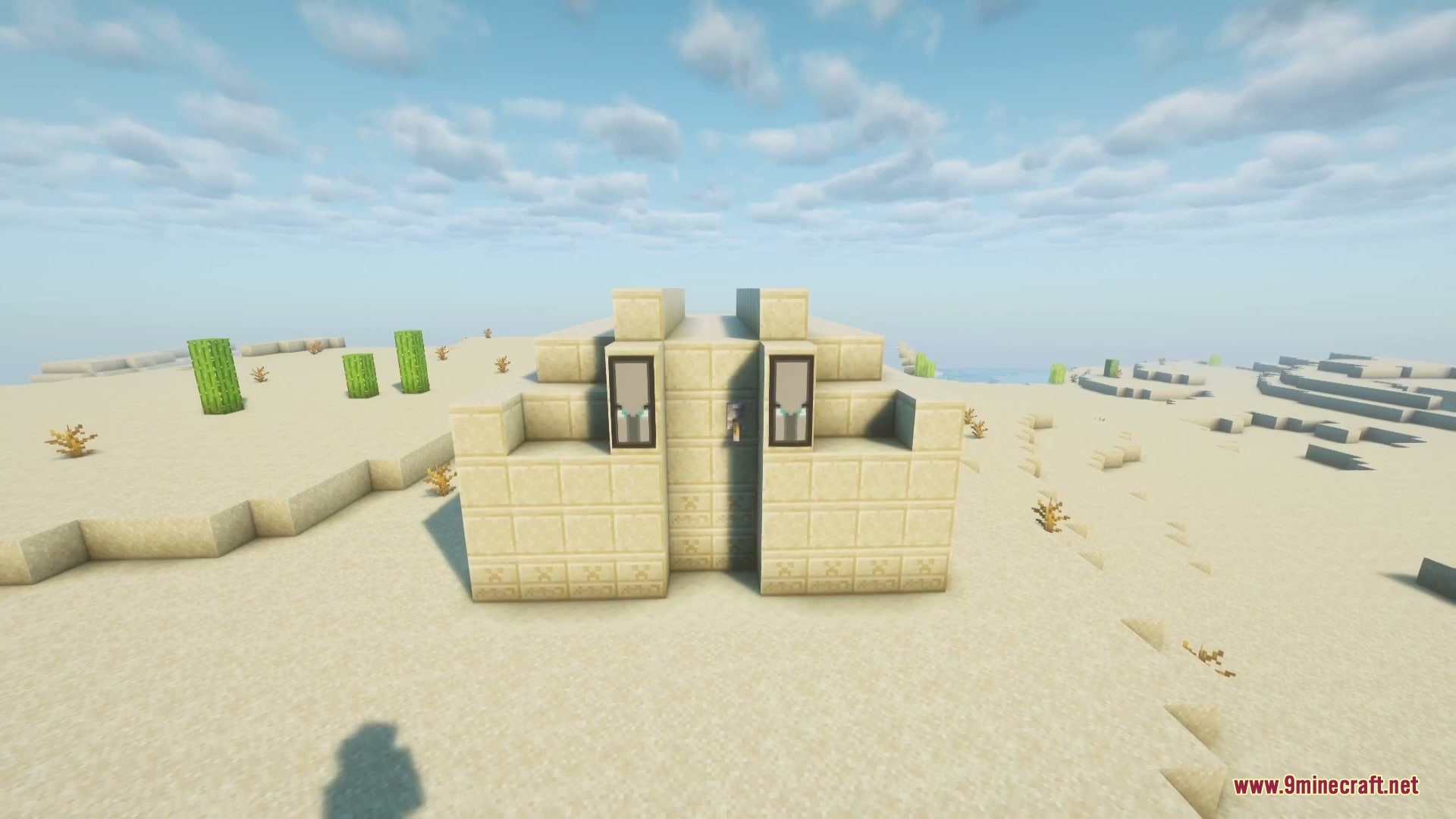 A small sandstone outpost with illager banners in a desert biome