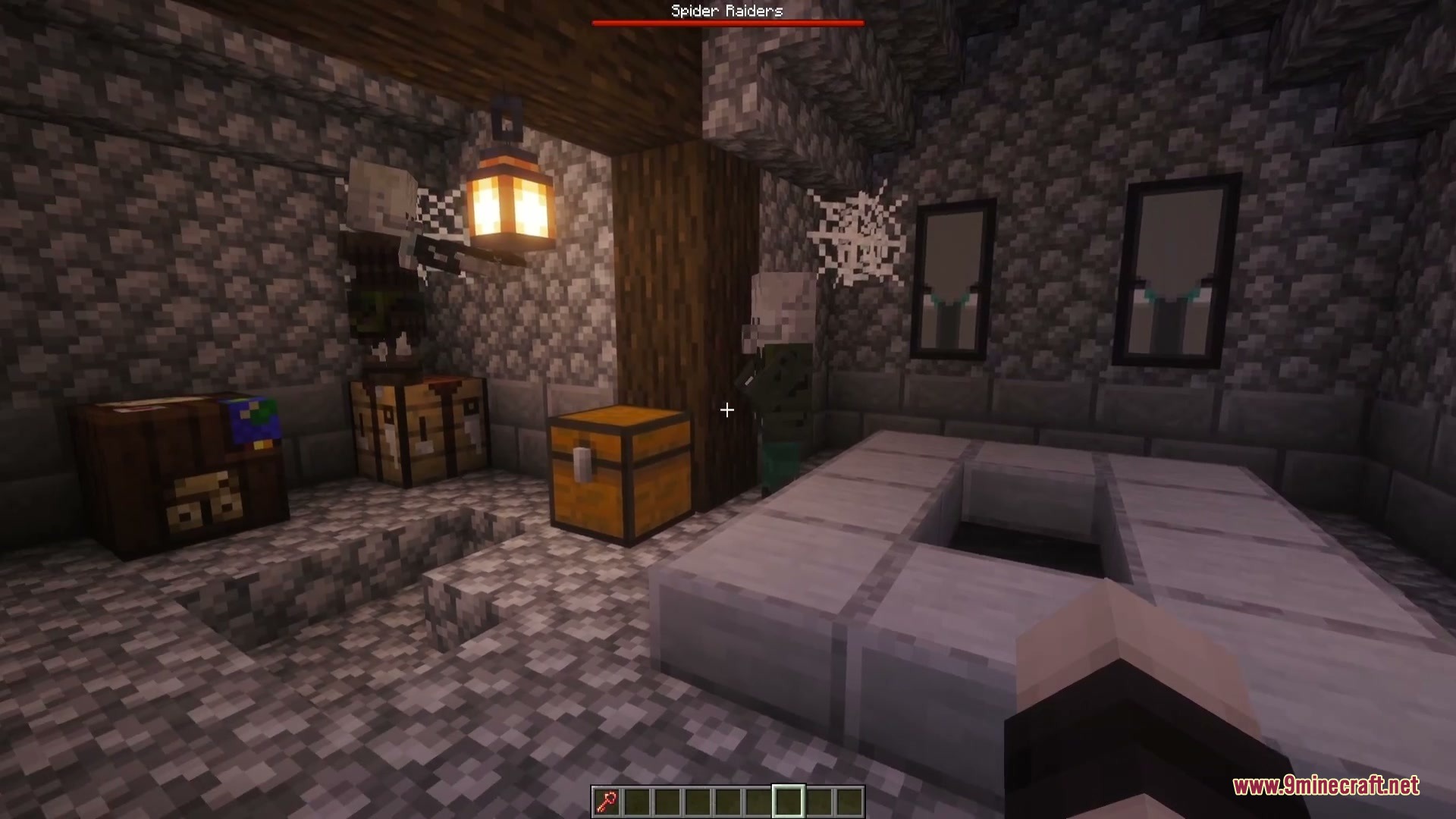 An illager stands in a cobblestone room under a Spider Raiders boss bar