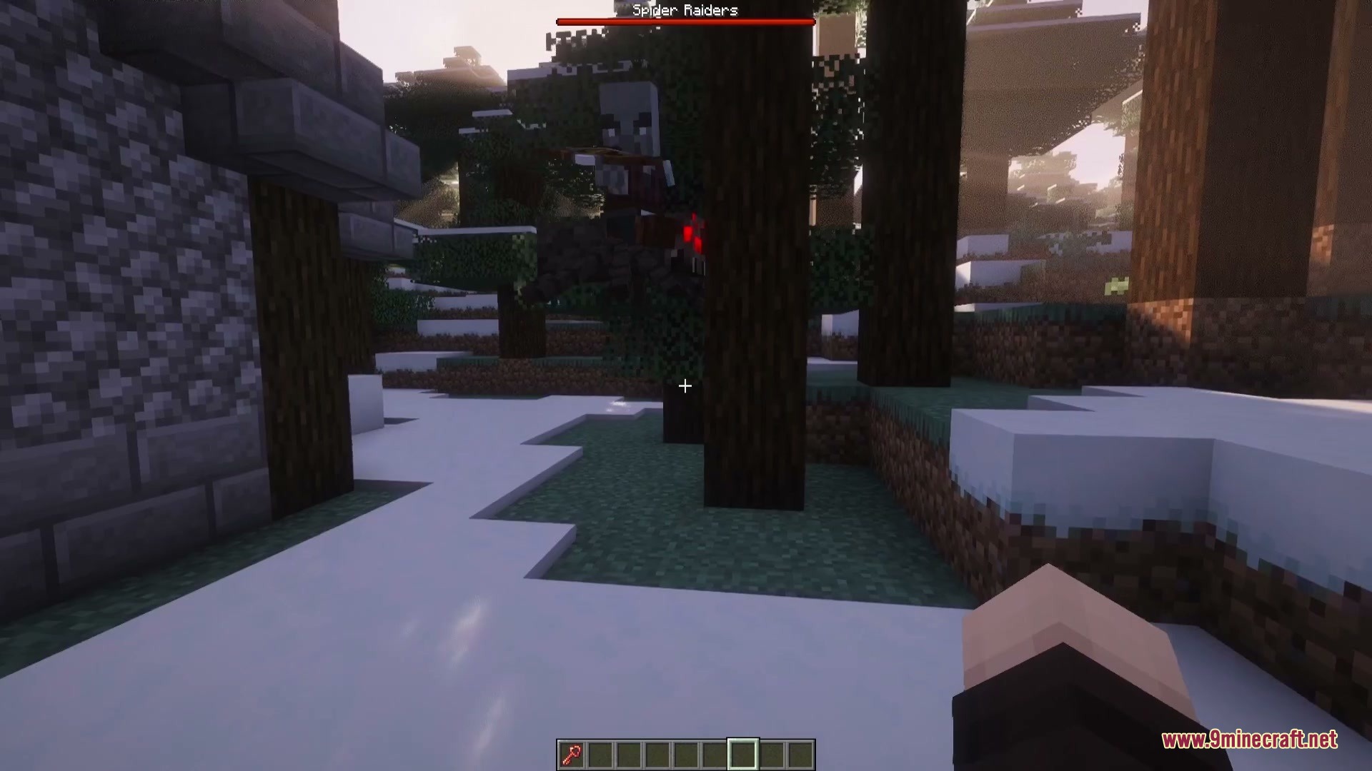 A Spider Raider attacks the player in a snowy forest biome
