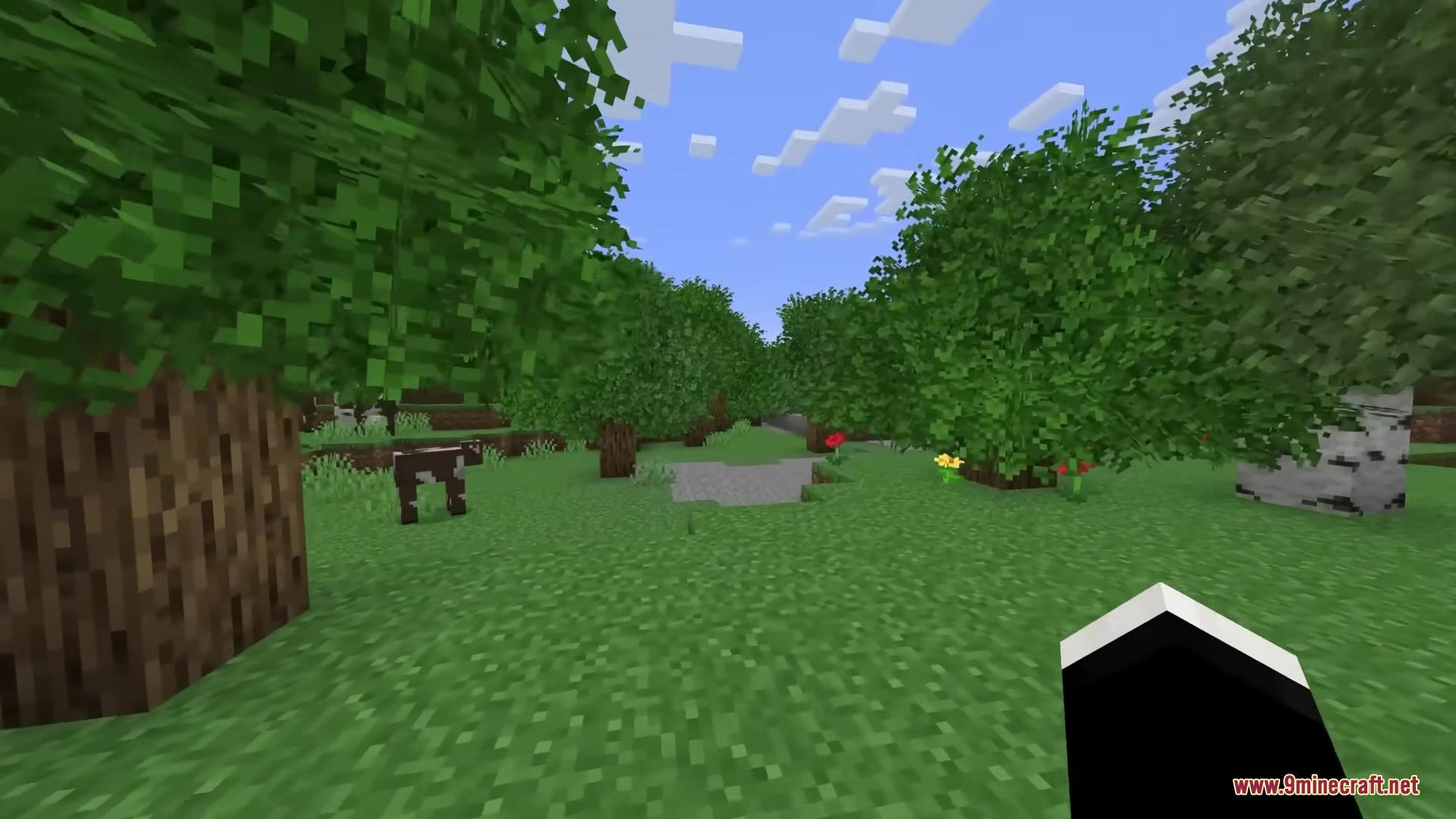 Rainbow's Foliage Polytone Resource Pack Screenshot 2 Lush green trees with bushy leaves in a forest with a cow nearby