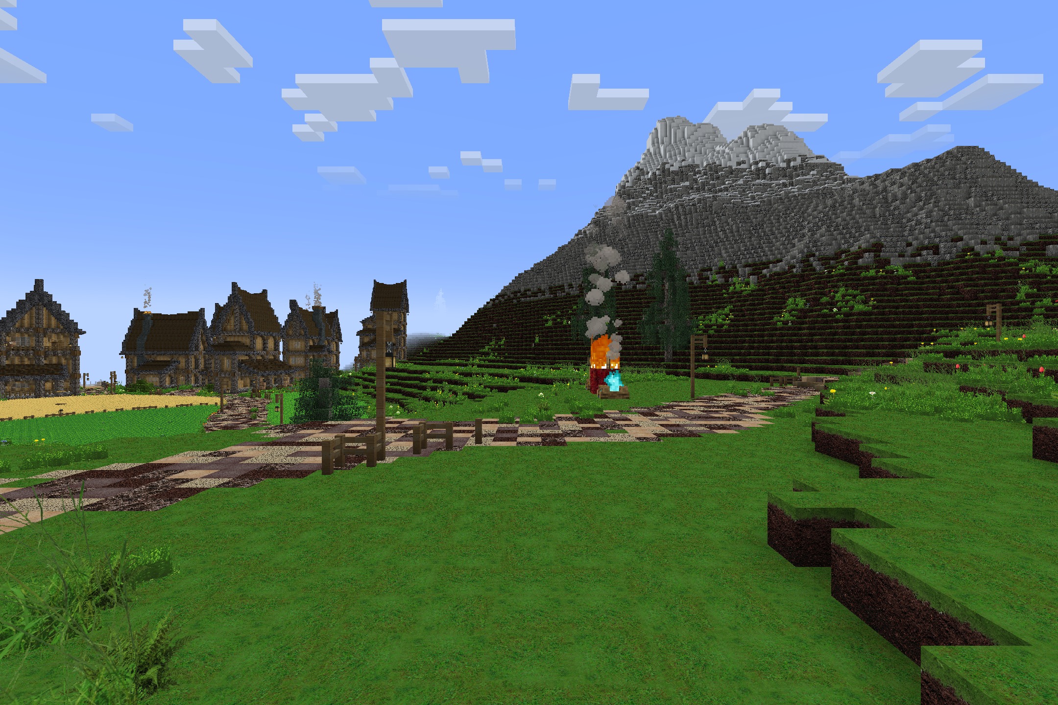 Realism Upscaled Resource Pack Screenshot 2 A village with a realistic mountain and a campfire under the sky