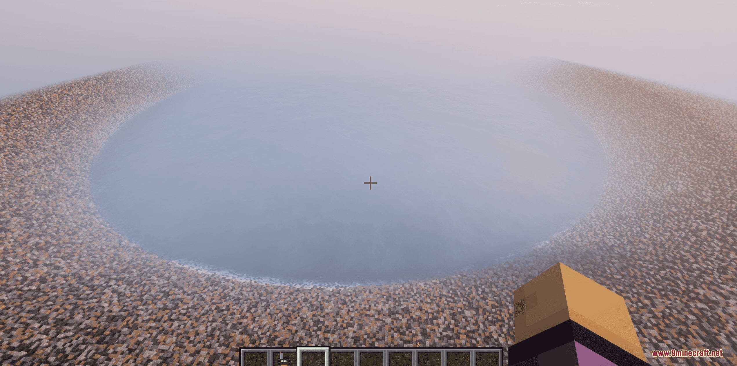 A massive circular crater filled with water created by the Realistic Nukes Mod