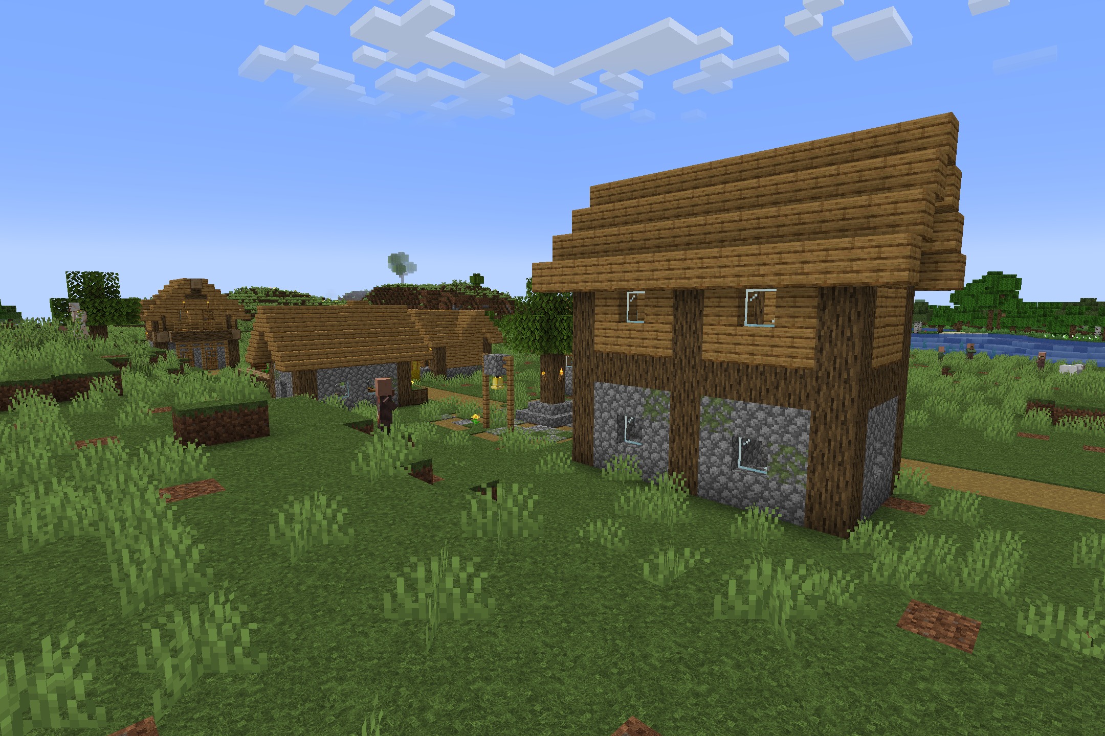 Realtastic X512 PBR POM Resource Pack Screenshot 3 Villager walking past a detailed wooden house in a peaceful Minecraft village