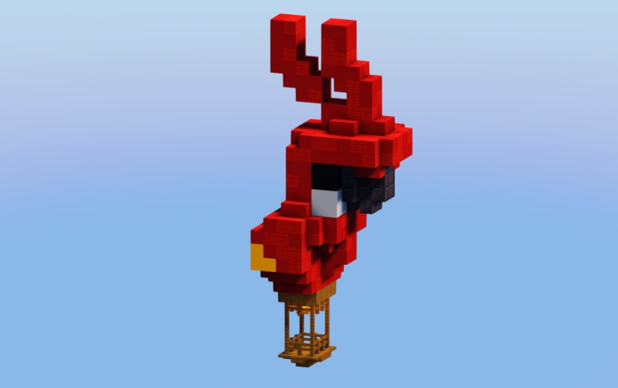 A colorful red parrot hot air balloon floating in a clear blue sky