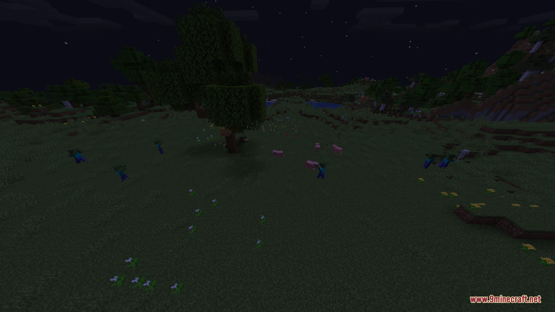 Multiple zombies wandering across a dark grassy field under the night sky