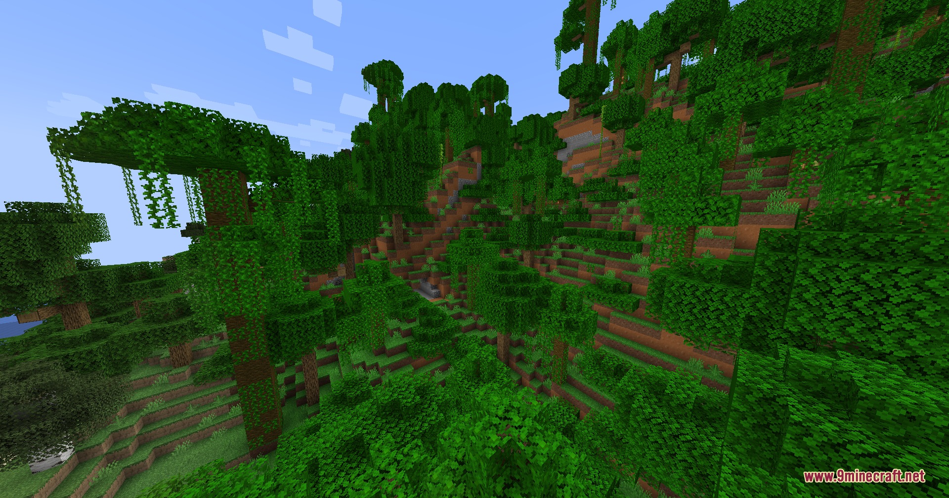 Rocks Done Right Mod Screenshot 2 Dense jungle vegetation and vines cover a steep hillside with layered soil blocks