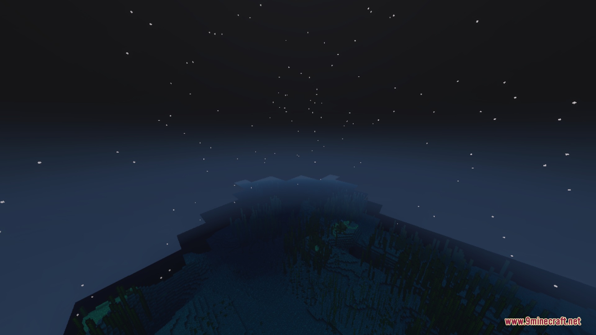Nighttime view of a dark ocean with stars and snow particles falling