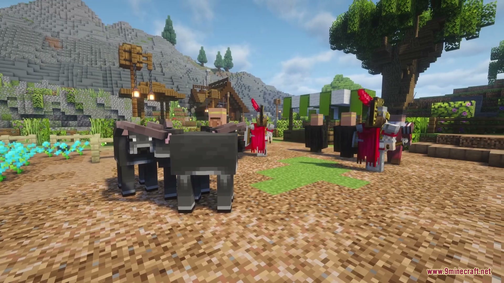 Villagers in historical Spanish attire gather with donkeys in a custom village