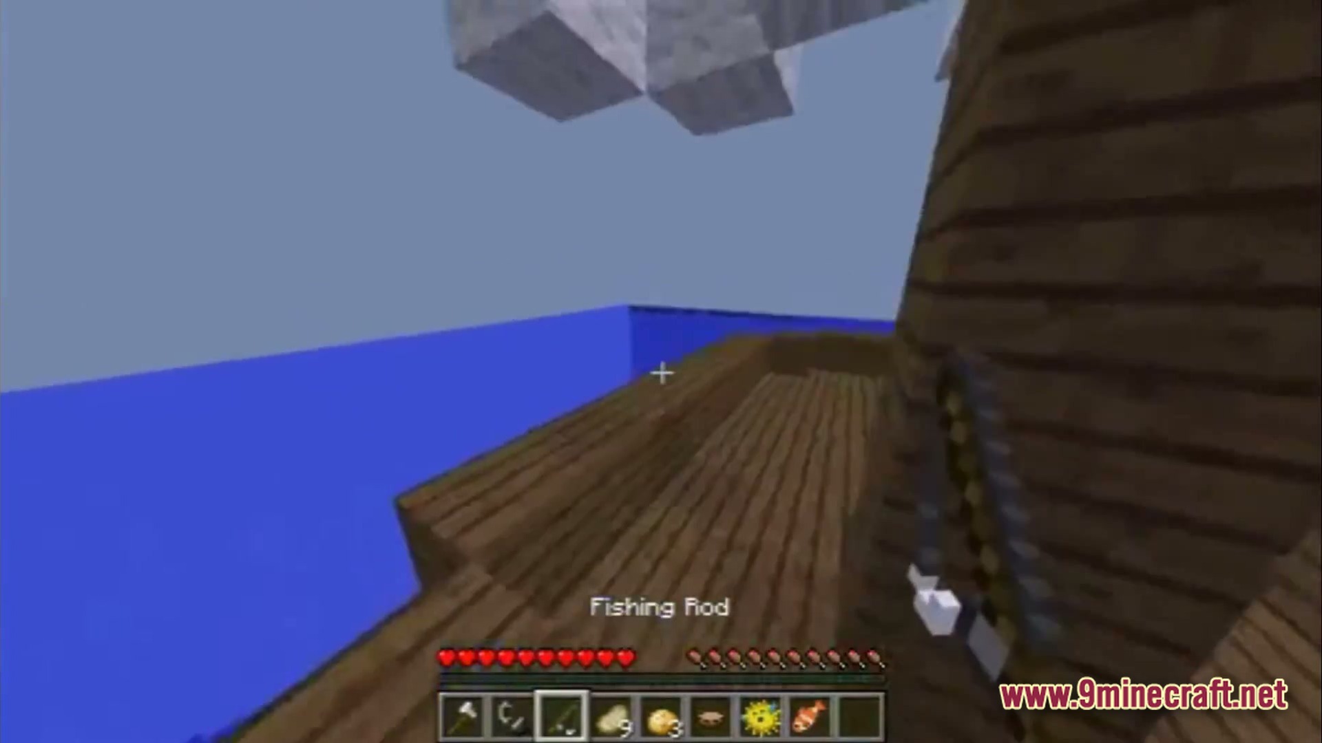Saltwater Chronicles Modpack Screenshot 2 A player stands on a wooden ship deck holding a fishing rod over the open ocean