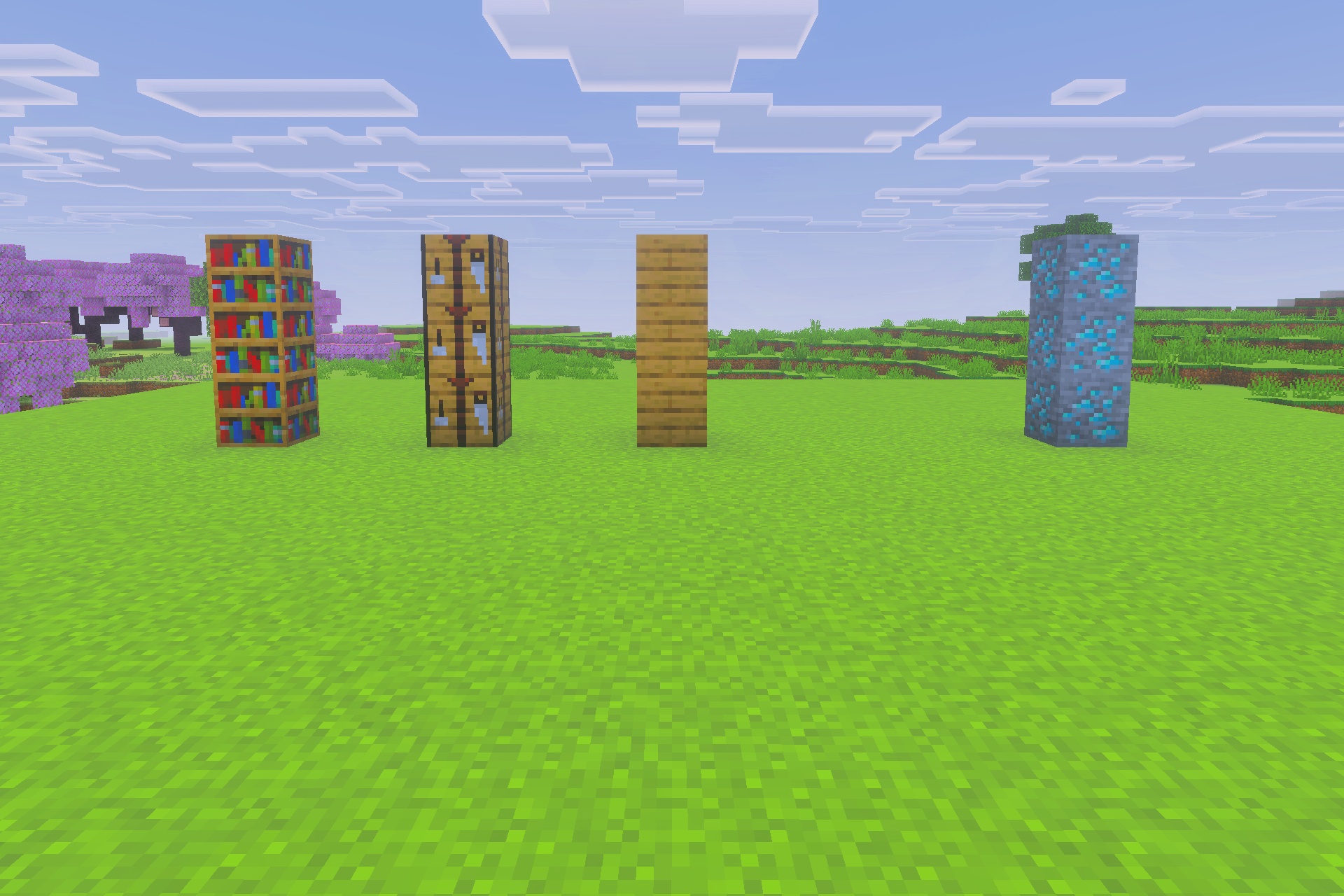 Various Minecraft blocks displayed with vibrant colors on a green field