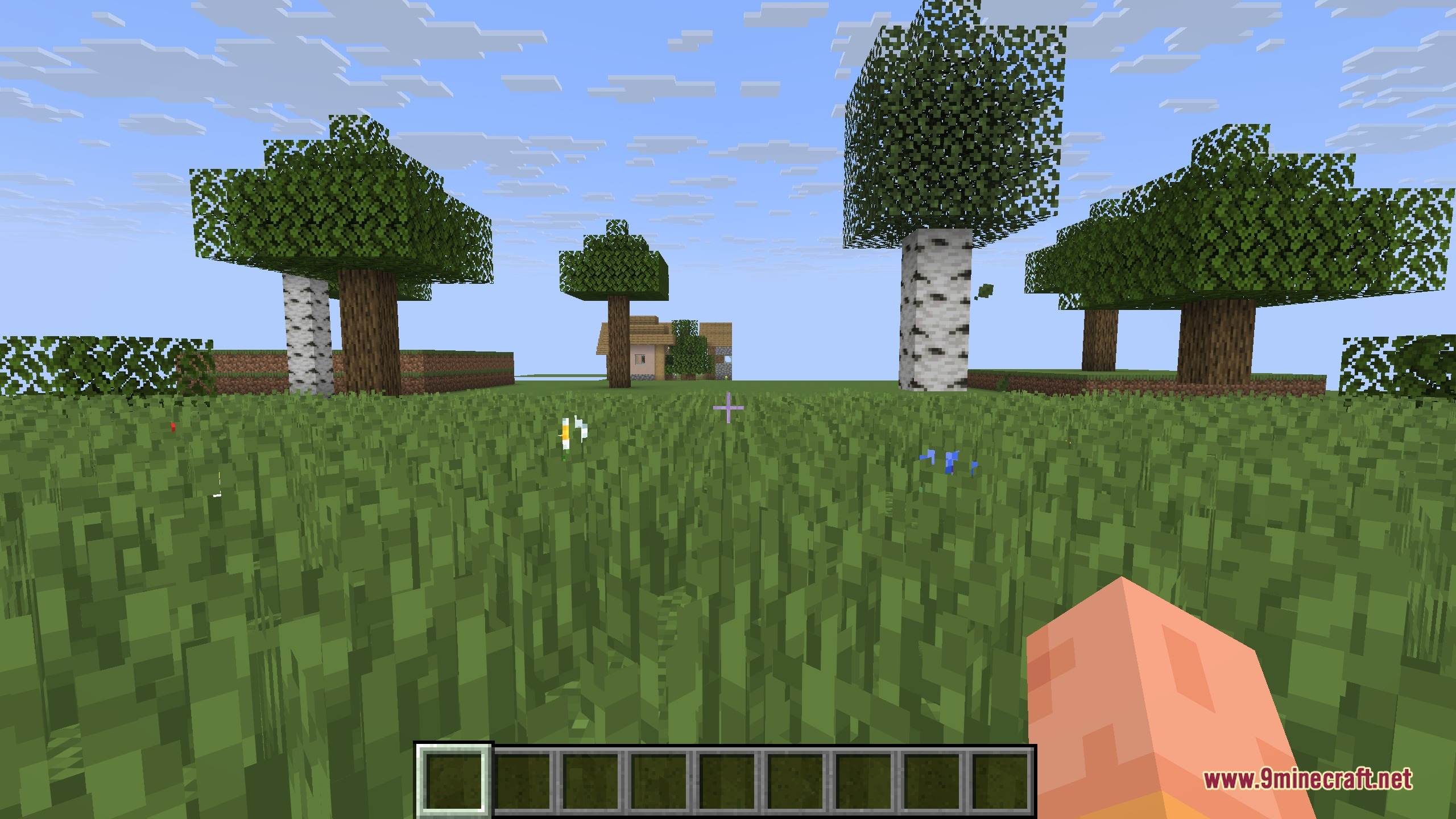 Seasons 9minecraft Mod Screenshot 5 A wall of lush green leaves and oak logs during the summer season