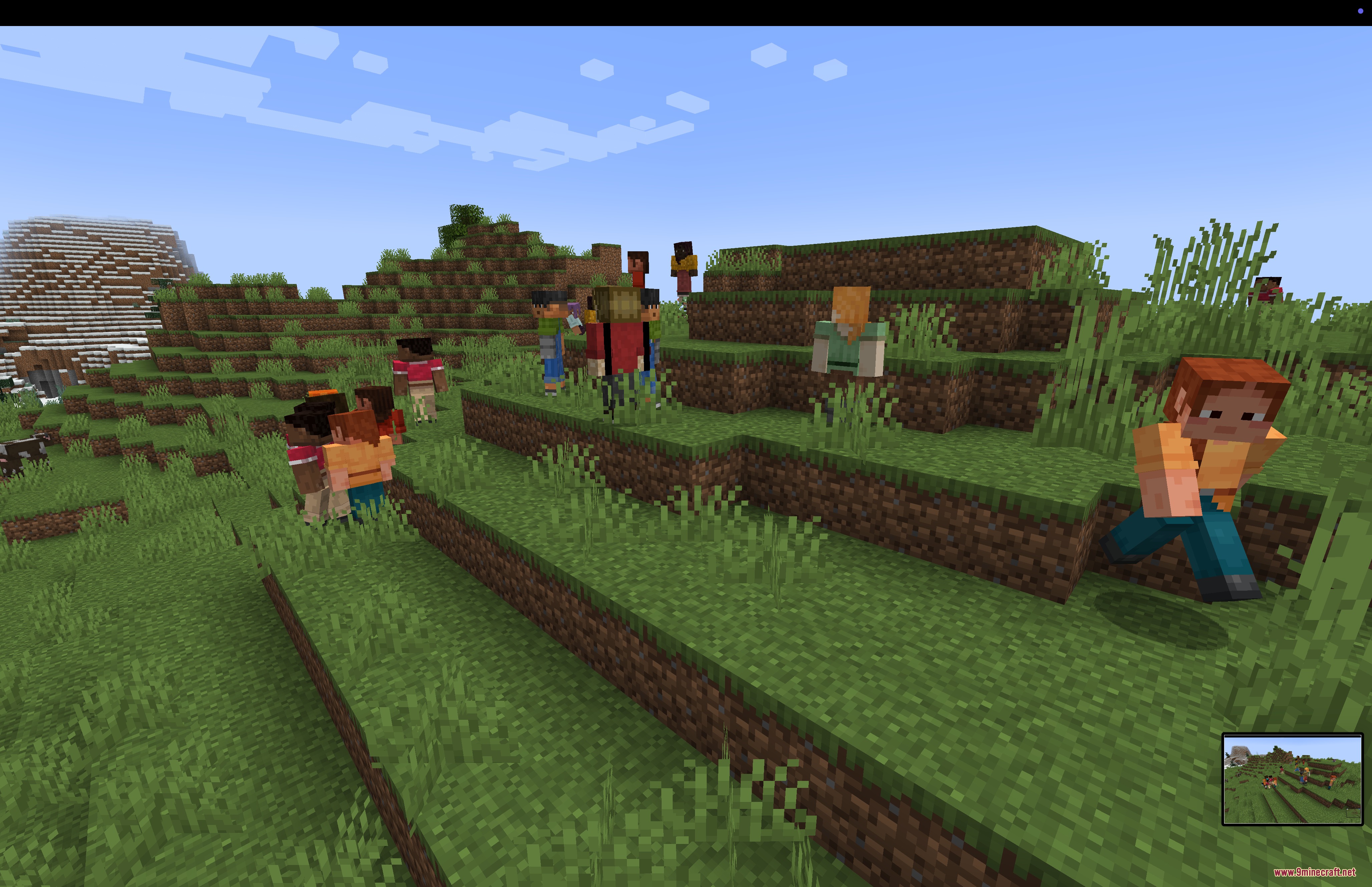 Humanoid mobs with diverse skins standing and running on a green grassy hillside