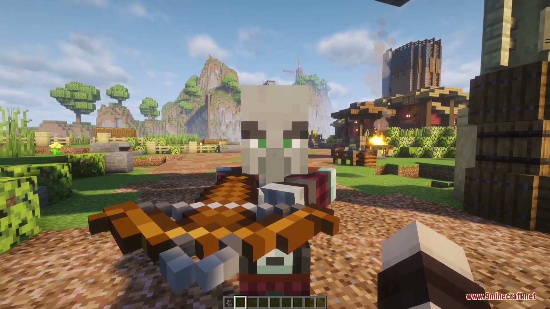 A Pillager points a crossbow at the player in a Minecraft village