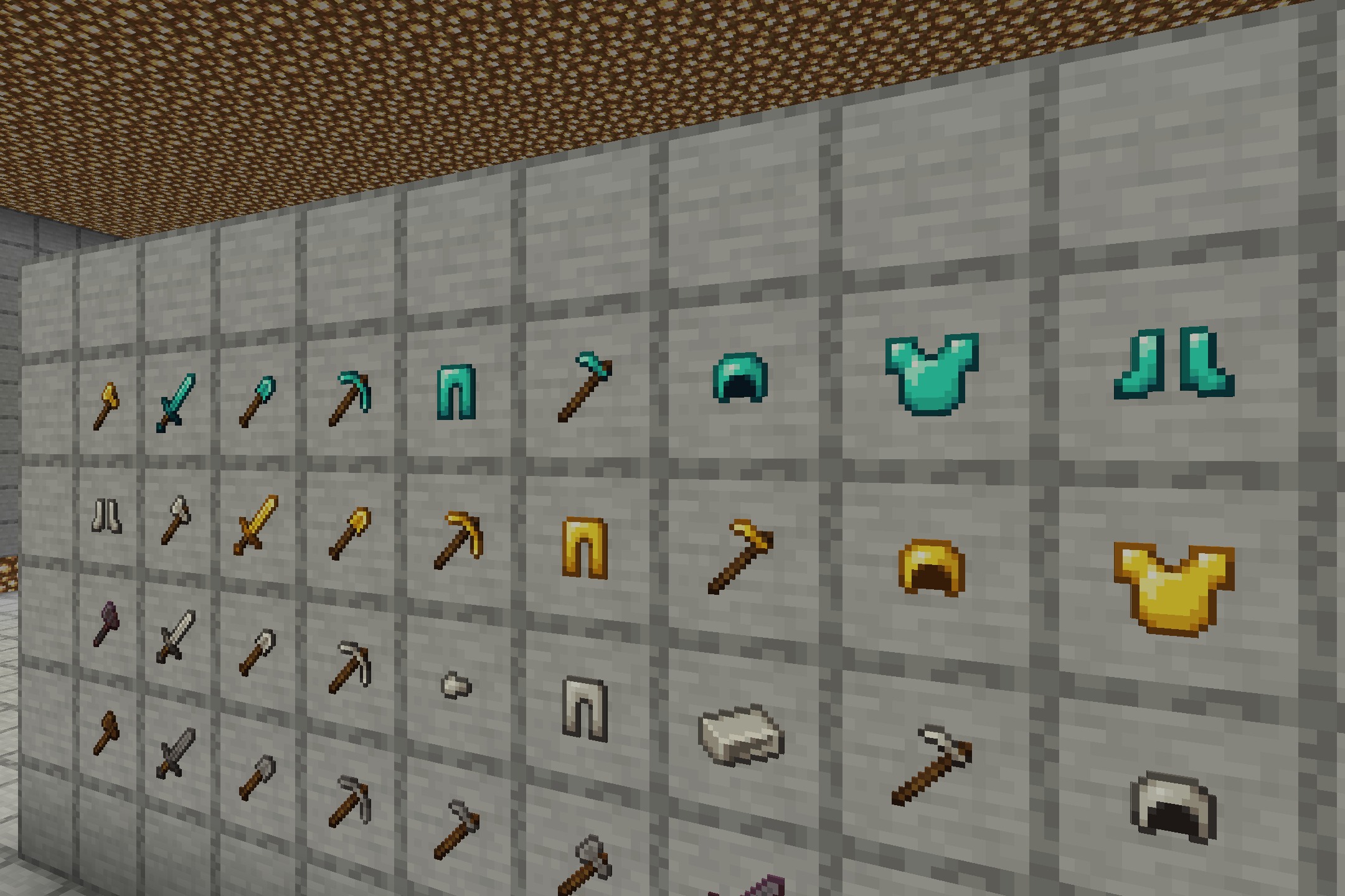 Various shiny tool and armor icons displayed in item frames on a wall
