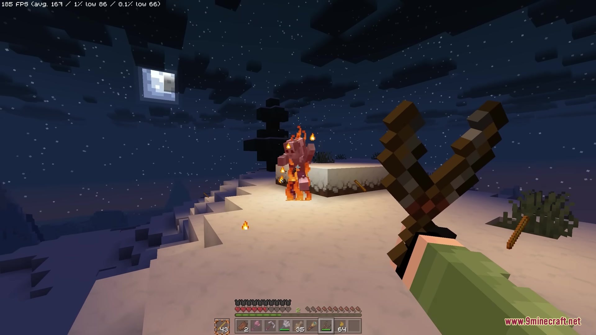 Simply Slingshot Mod Screenshot 6 A player uses a slingshot to set a distant mob on fire at night