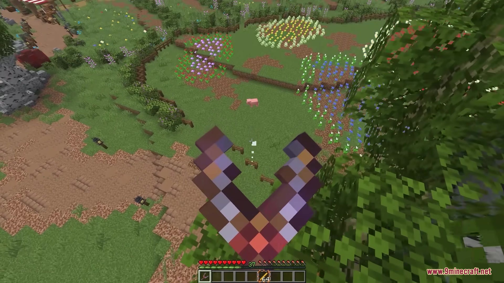 Simply Slingshot Mod Screenshot 8 Player holding a slingshot while looking down at a colorful flower field