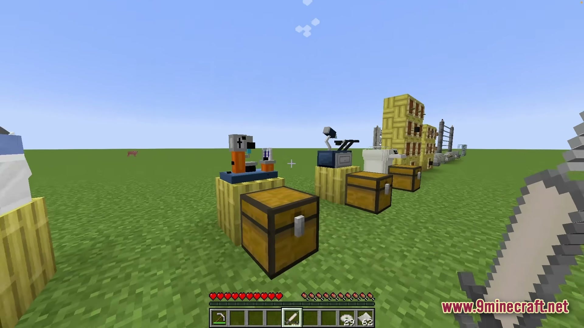 Sinothe Dino's Dinosaurs Modpack Screenshot 3 Various laboratory machines and storage chests are placed on a flat grass plain in Minecraft