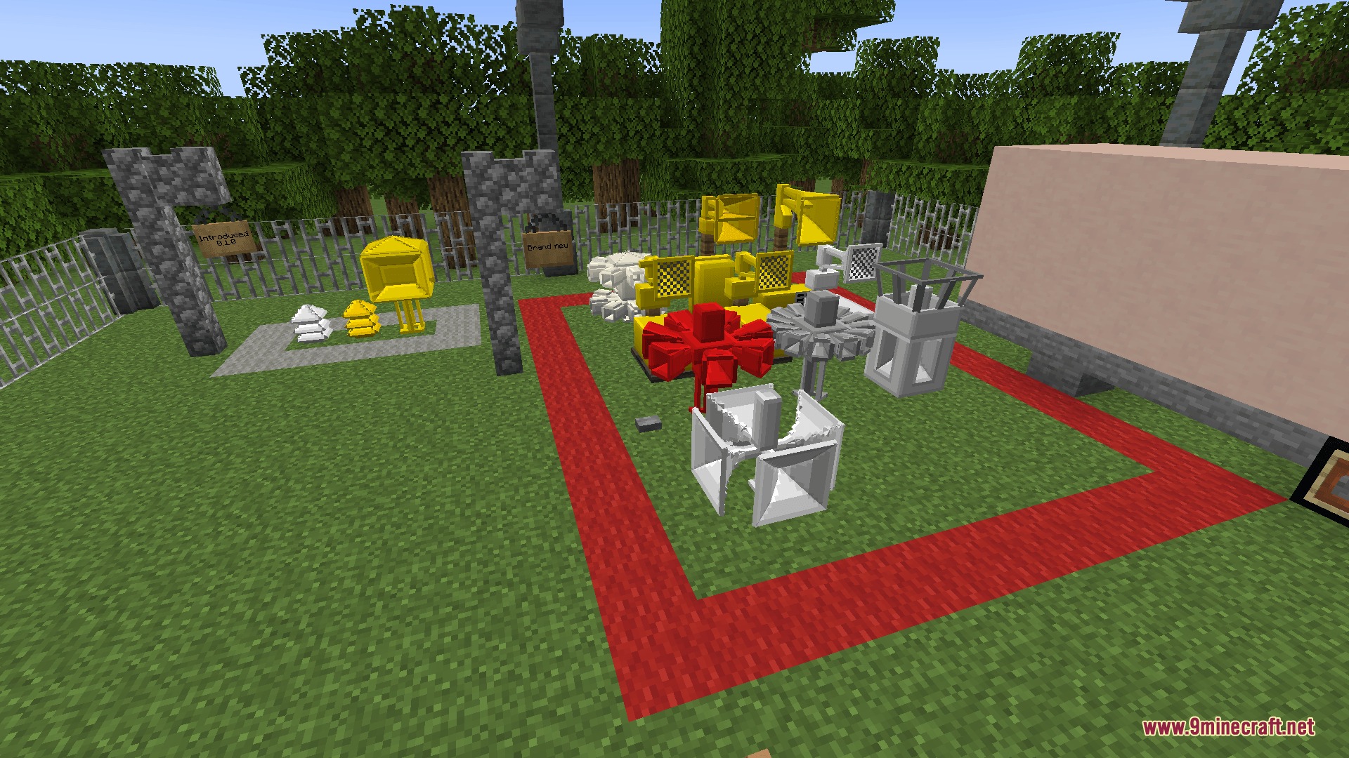 Sirencraft Mod Screenshot 4 Various colorful siren models displayed on a grass field inside a fenced area
