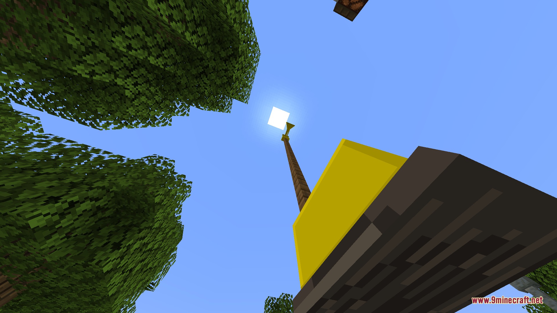 Sirencraft Mod Screenshot 7 Looking up at a yellow air raid siren against a clear sky