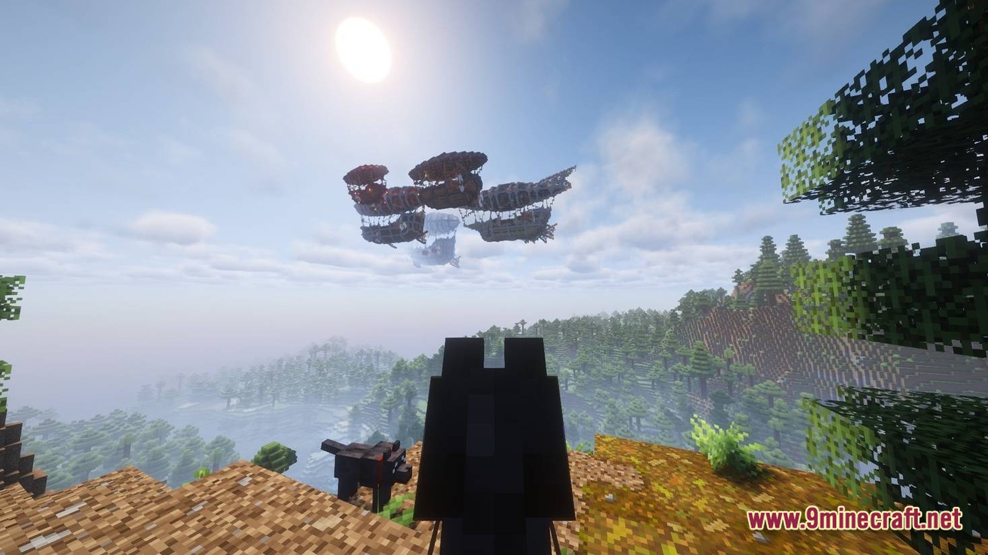 Skybound Engineering Alpha Modpack Screenshot 9 A group of airships flies over a forested mountain landscape under a bright sun