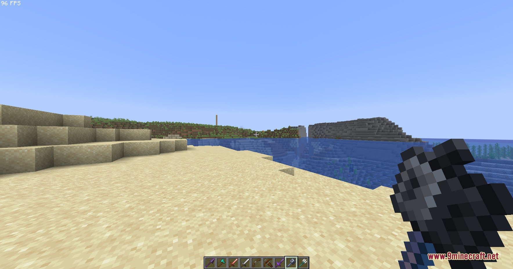 Small Hand Tools Resource Pack Screenshot 2 A player holds a compact mace while looking out at the ocean